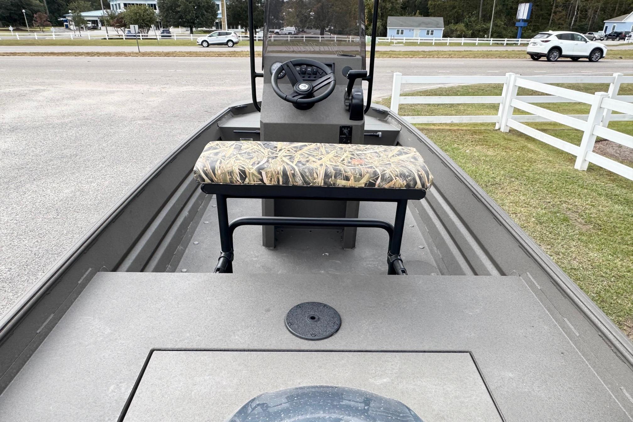 2026 Alweld 1656VV Marsh Console CC boat interior with camo seat and steering console.