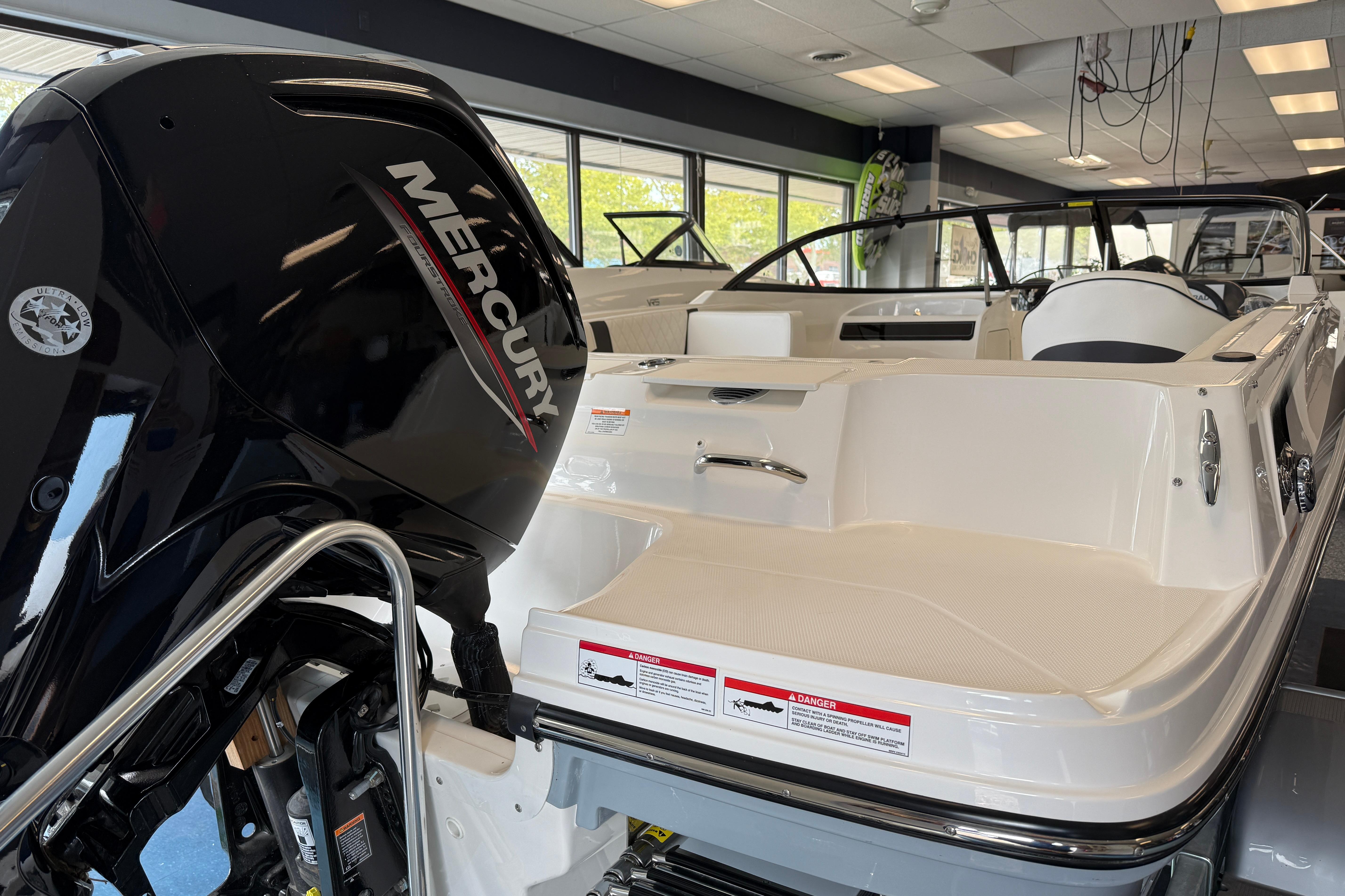 2025 Bayliner VR4 Bowrider OB with Mercury outboard engine in showroom.