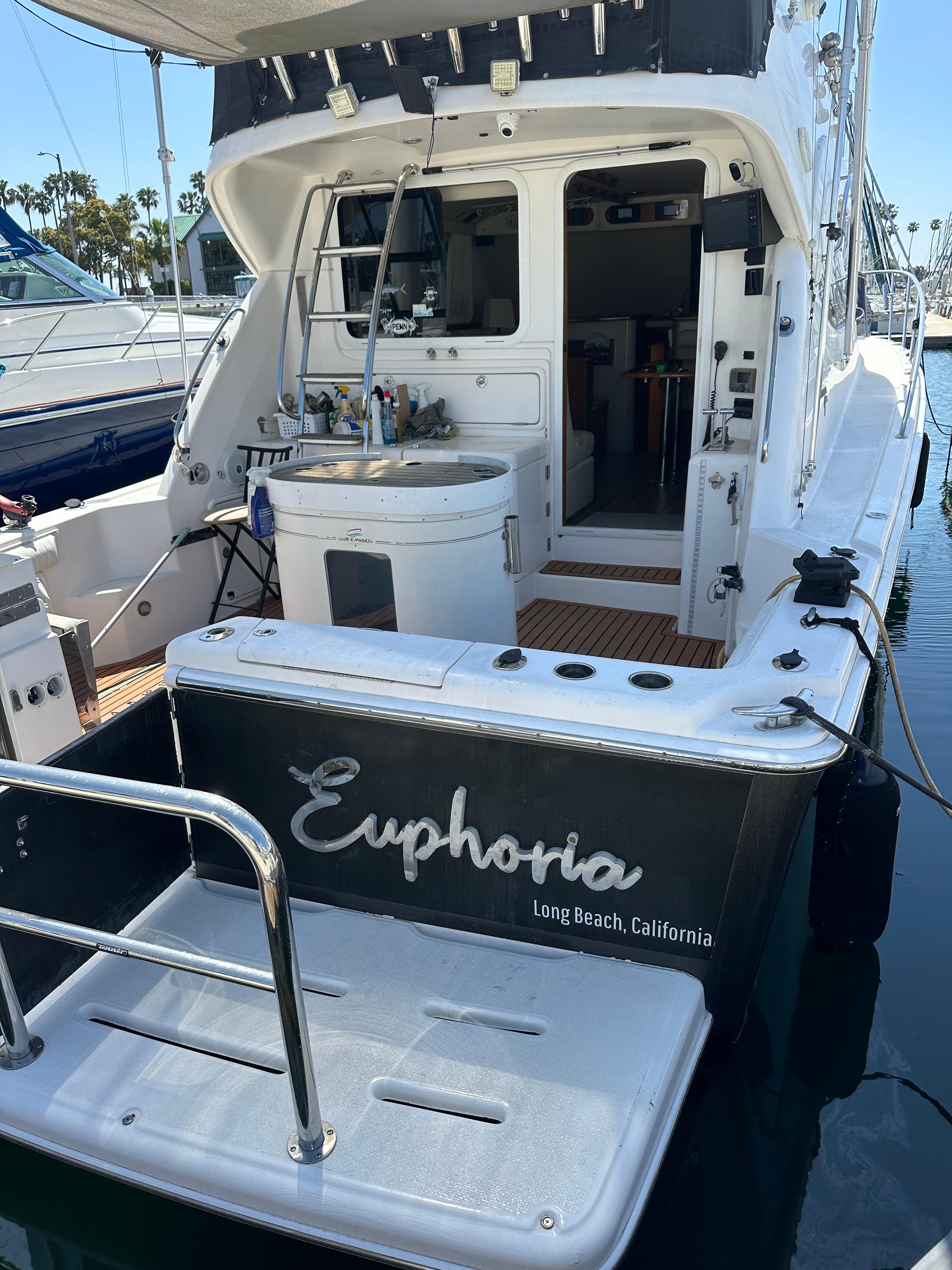 Riviera 37 Flybridge yacht, 2003 model, docked in Long Beach, California.