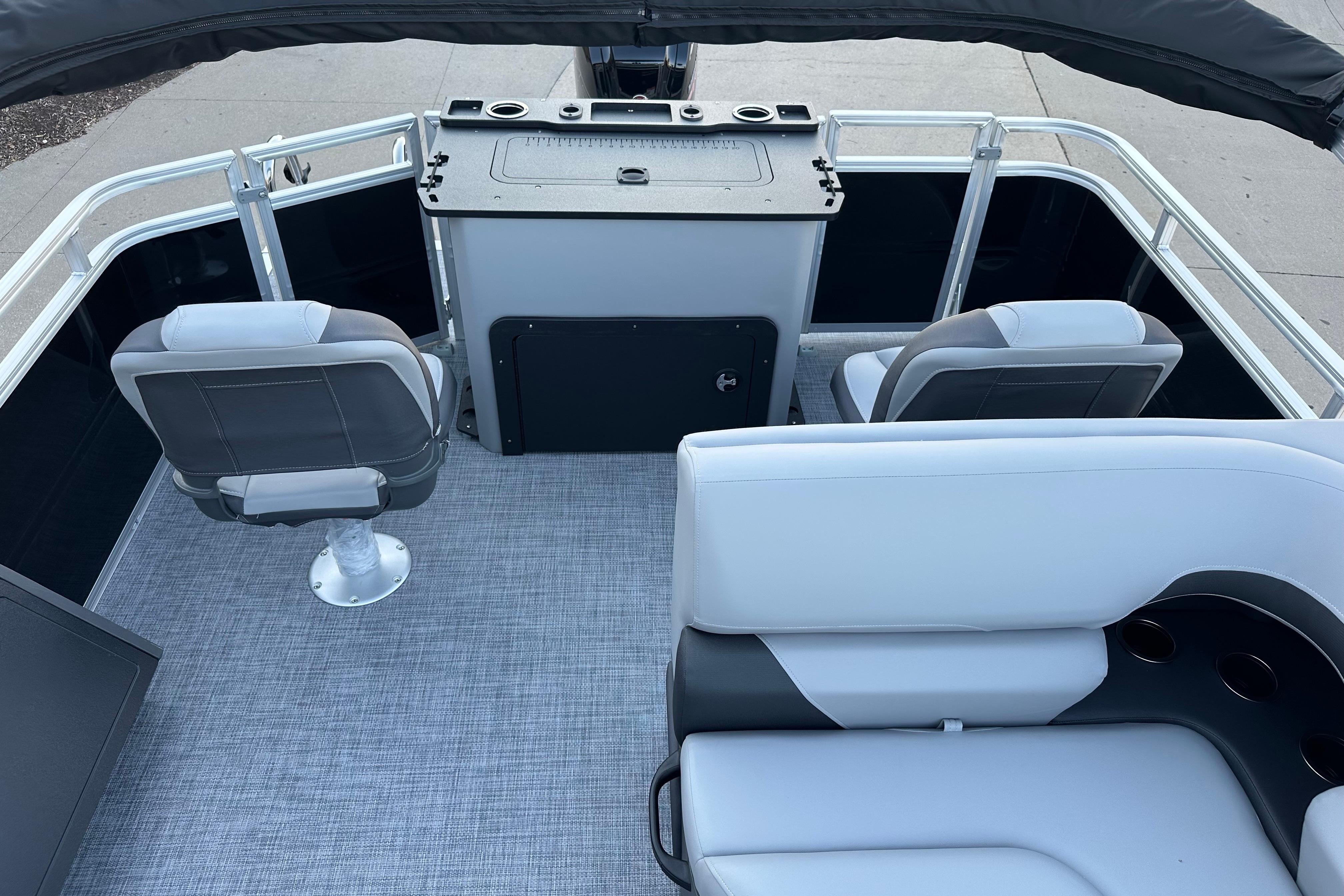 2026 Sun Tracker SportFish 22 DLX interior with seating and helm station.