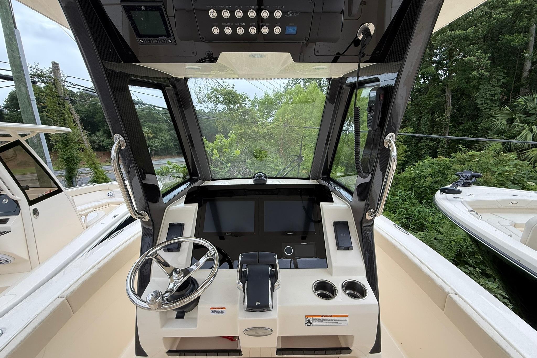 2026 Scout 260 LXF boat dashboard with steering wheel and control panel.