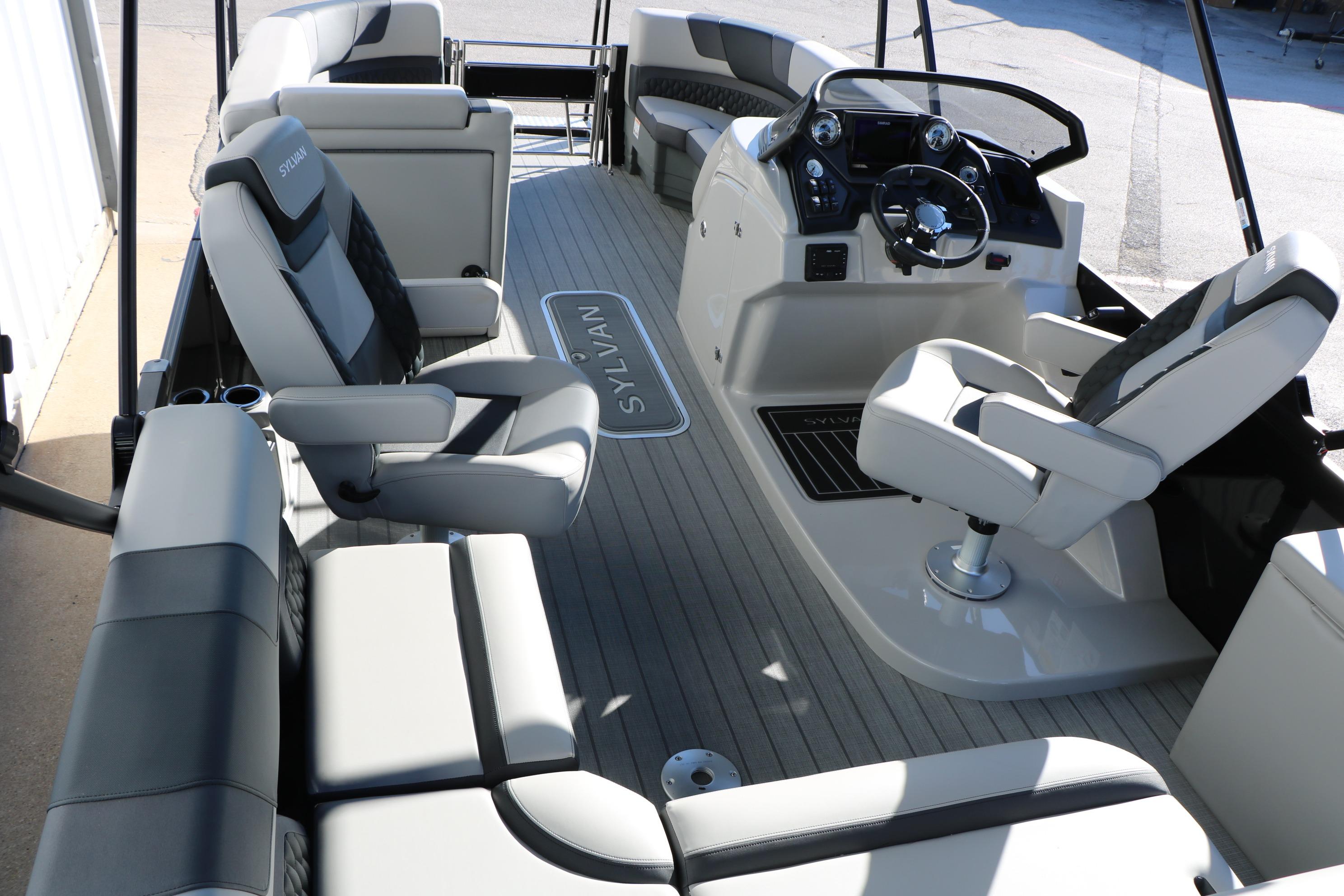Interior of 2026 Sylvan L3 CLZ DH boat with modern seating and steering console.