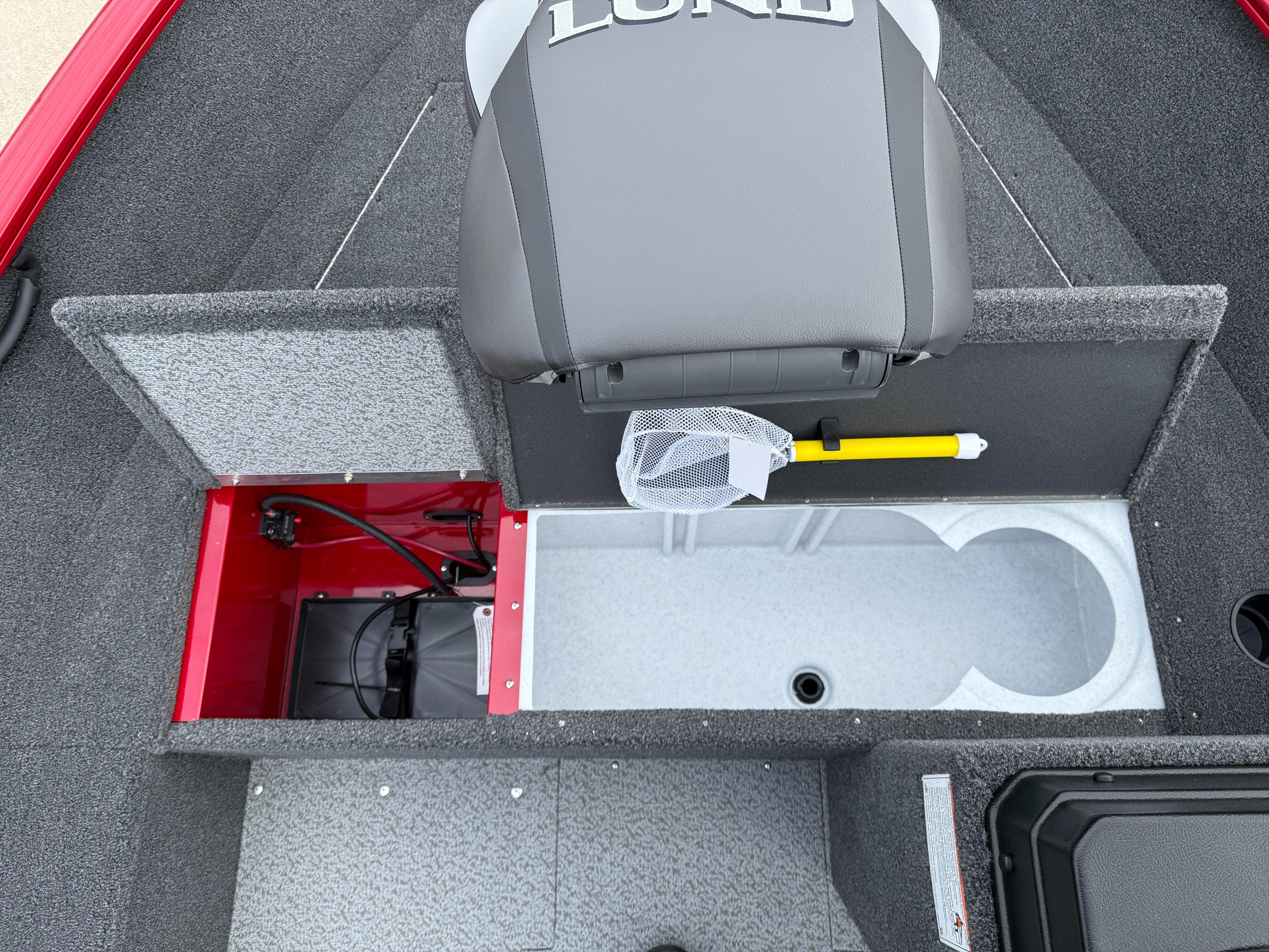 2025 Lund 1650 Rebel XL SS boat interior with storage compartments and seating.