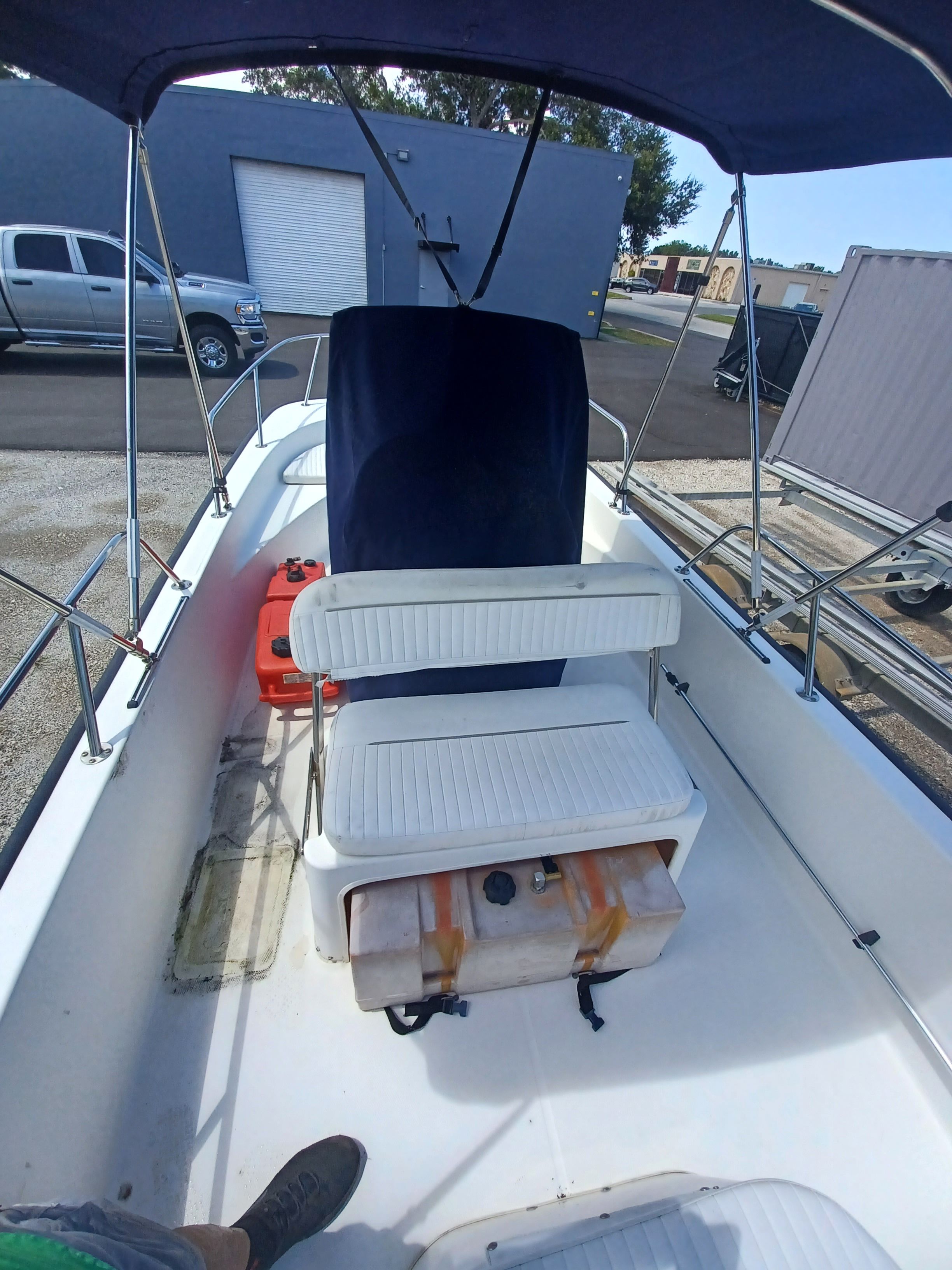 Interior view of a 2008 Boston Whaler 170 Montauk with bench seating and console.