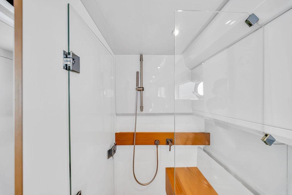 Modern shower area in 2021 Bluegame BG 42 yacht, featuring sleek design and glass enclosure.
