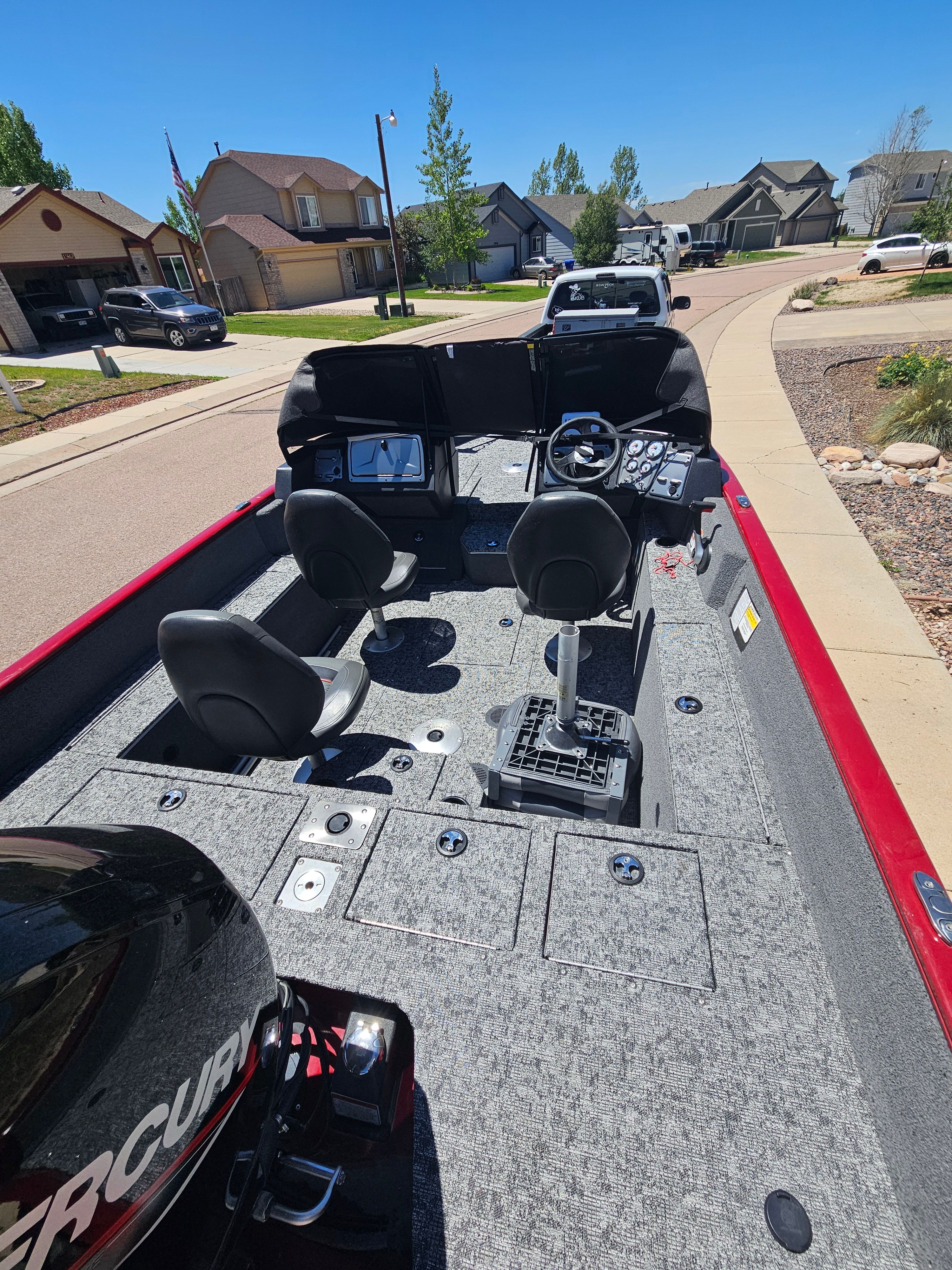 2021 Tracker Pro Guide V-175 WT boat on a residential street.