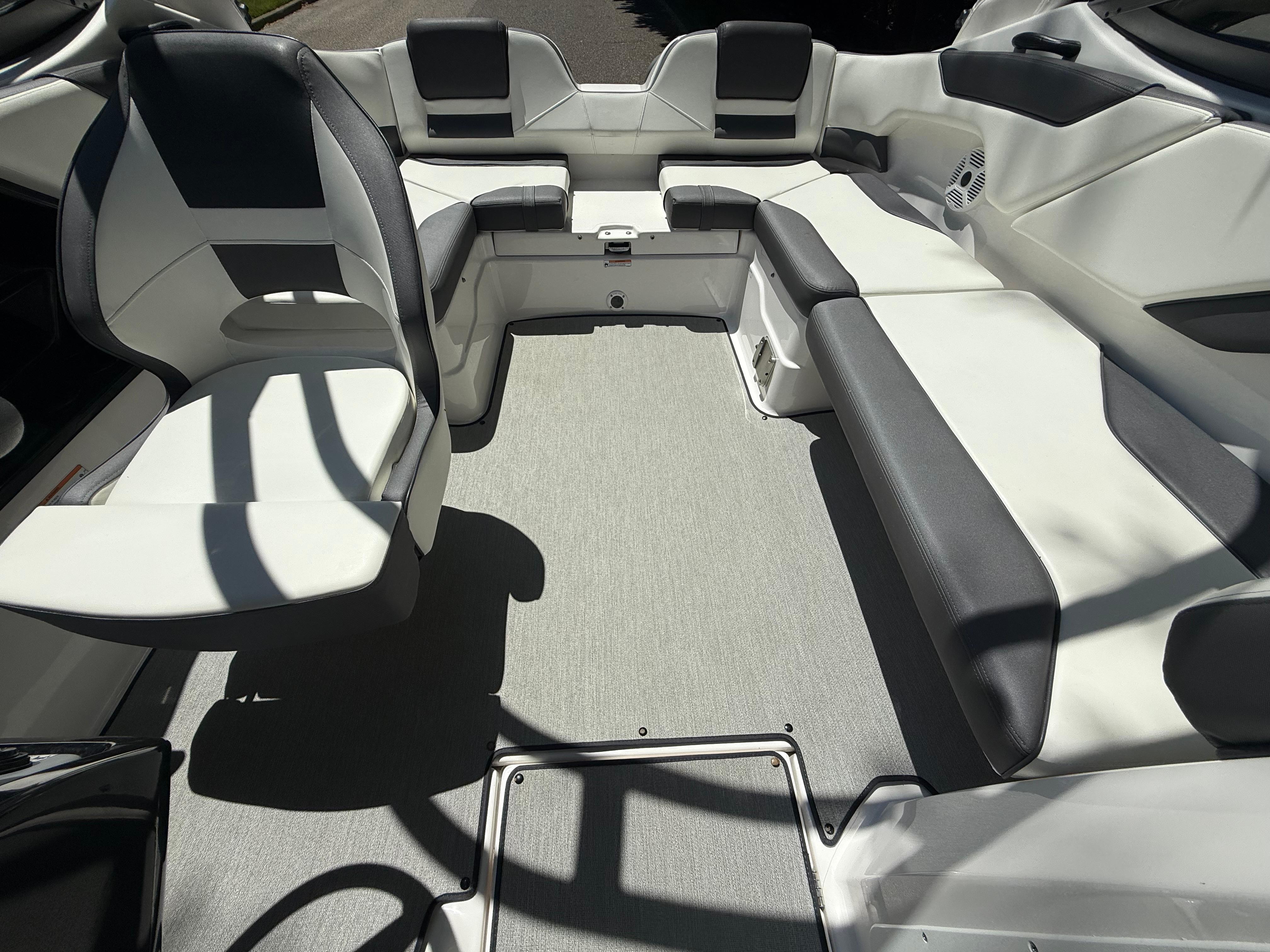 2022 Yamaha AR210 boat interior with gray and white seating arrangement.