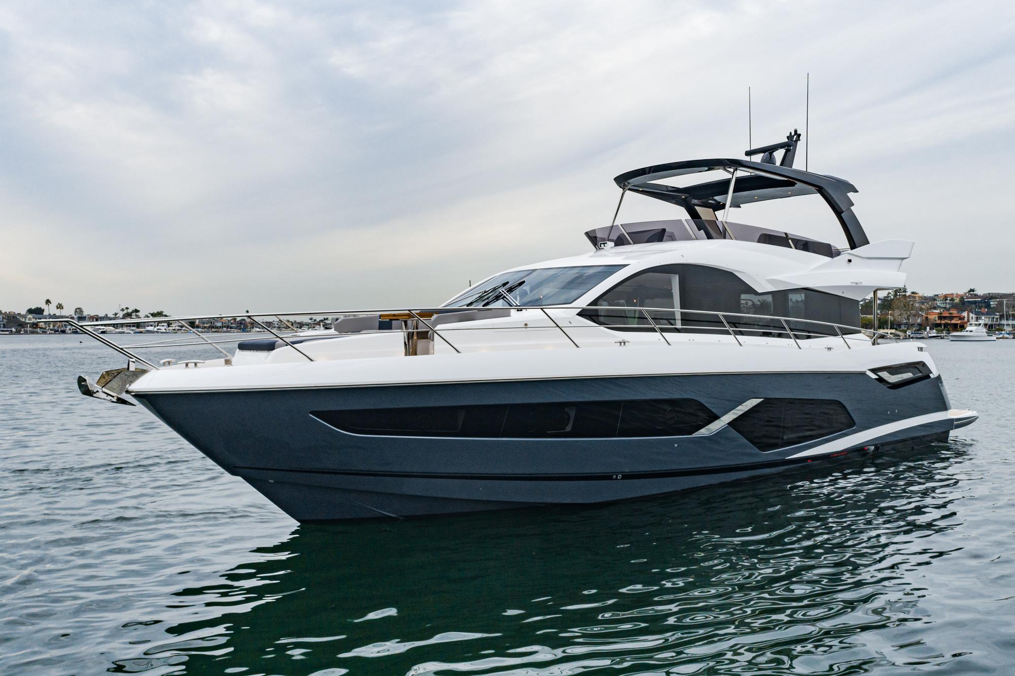 Luxury yacht Sunseeker Manhattan 68, 2023 model, on calm waters.