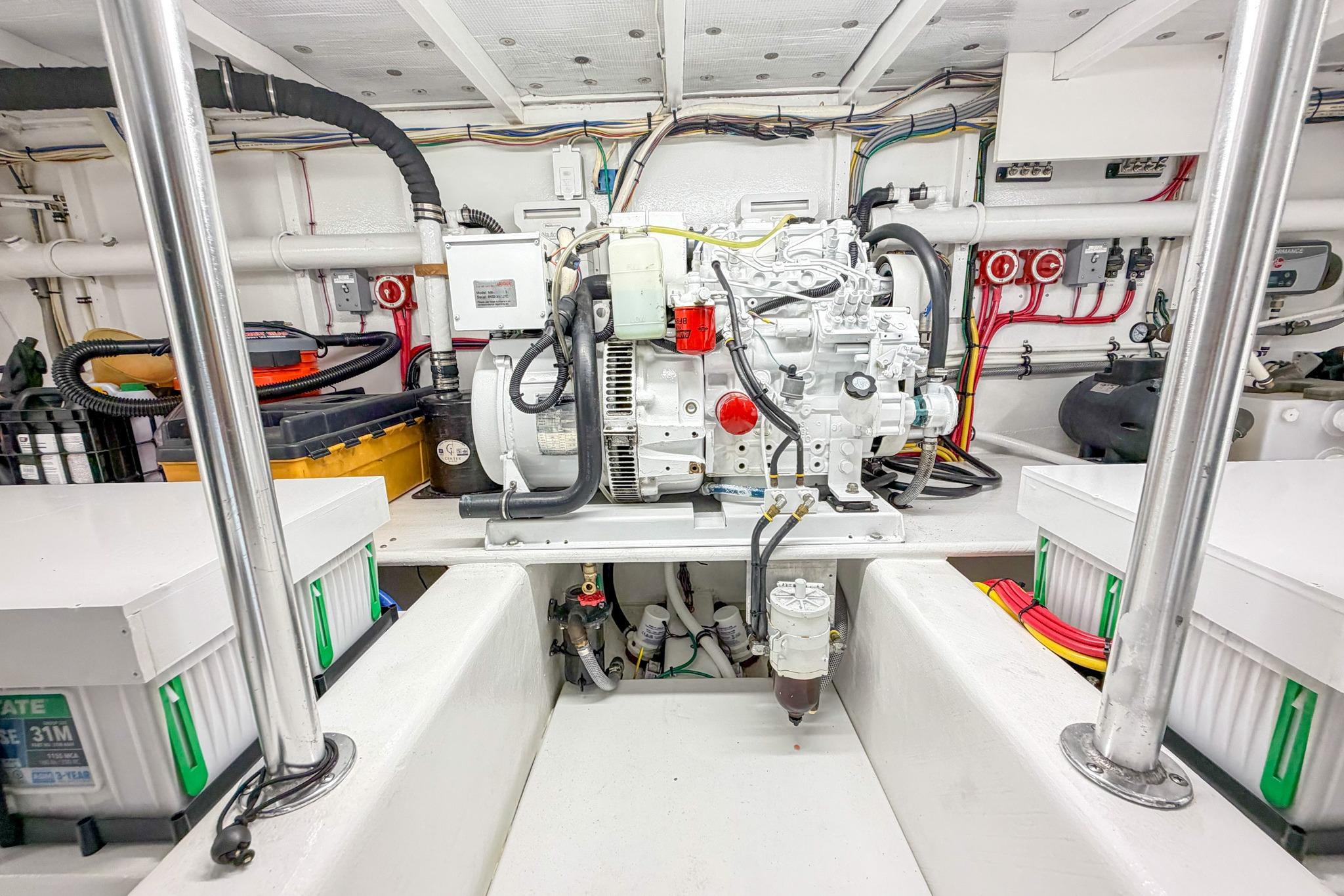 Engine room of 1998 Blackwell Custom Carolina Sportfish, showcasing generator and wiring.