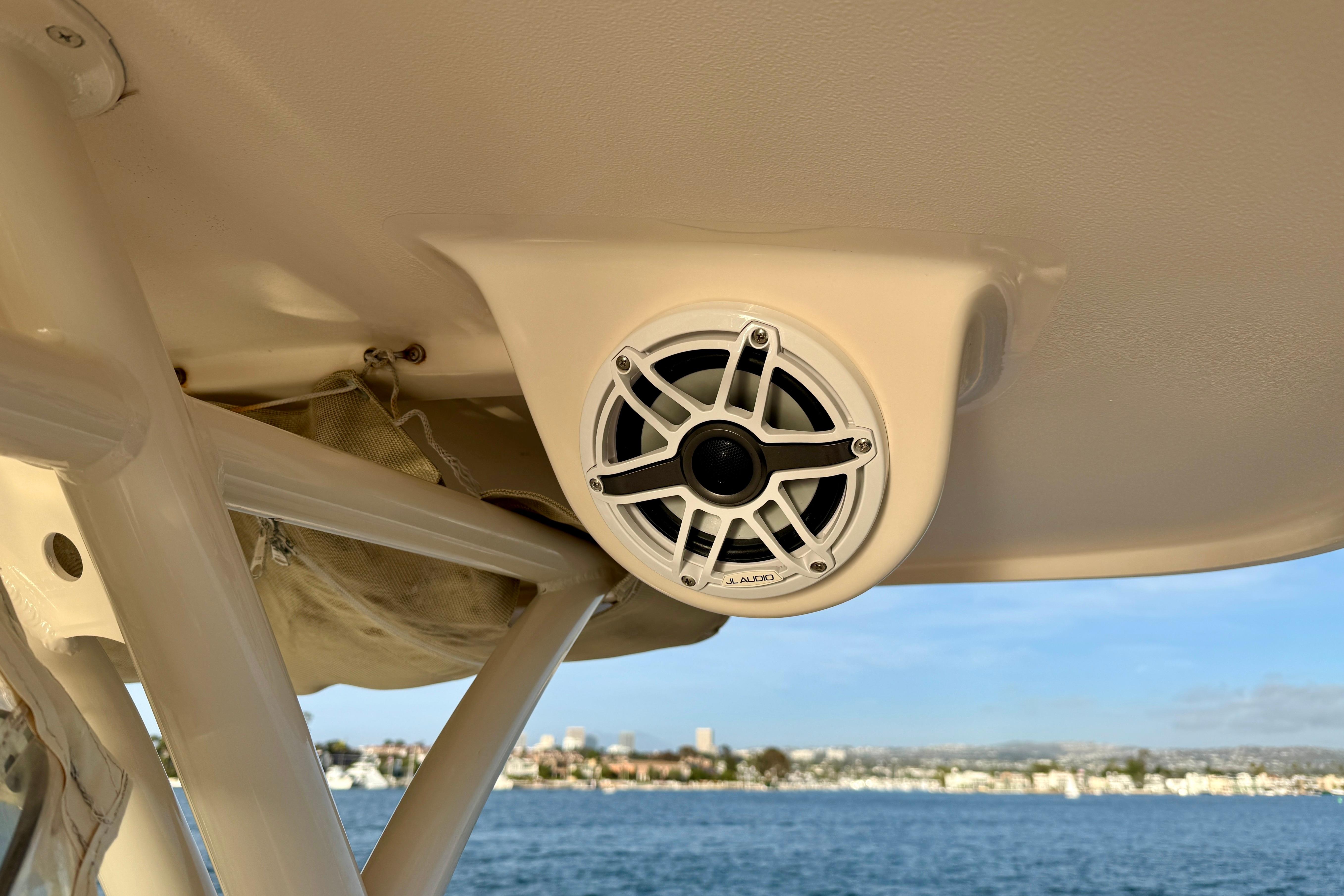 JL Audio speaker on 2012 Grady-White Canyon 336 boat, overlooking scenic waterfront.