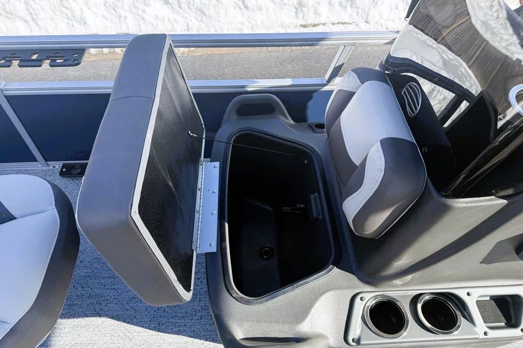 2026 Sun Tracker Bass Buggy 16 XL Select boat seat with storage compartment open.