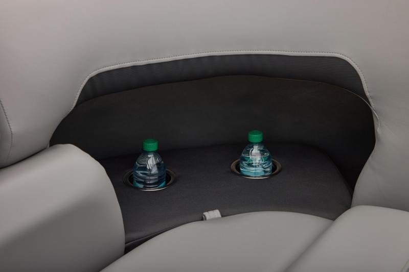 Cup holders with water bottles on Sun Tracker Party Barge 22 DLX, 2026 model.
