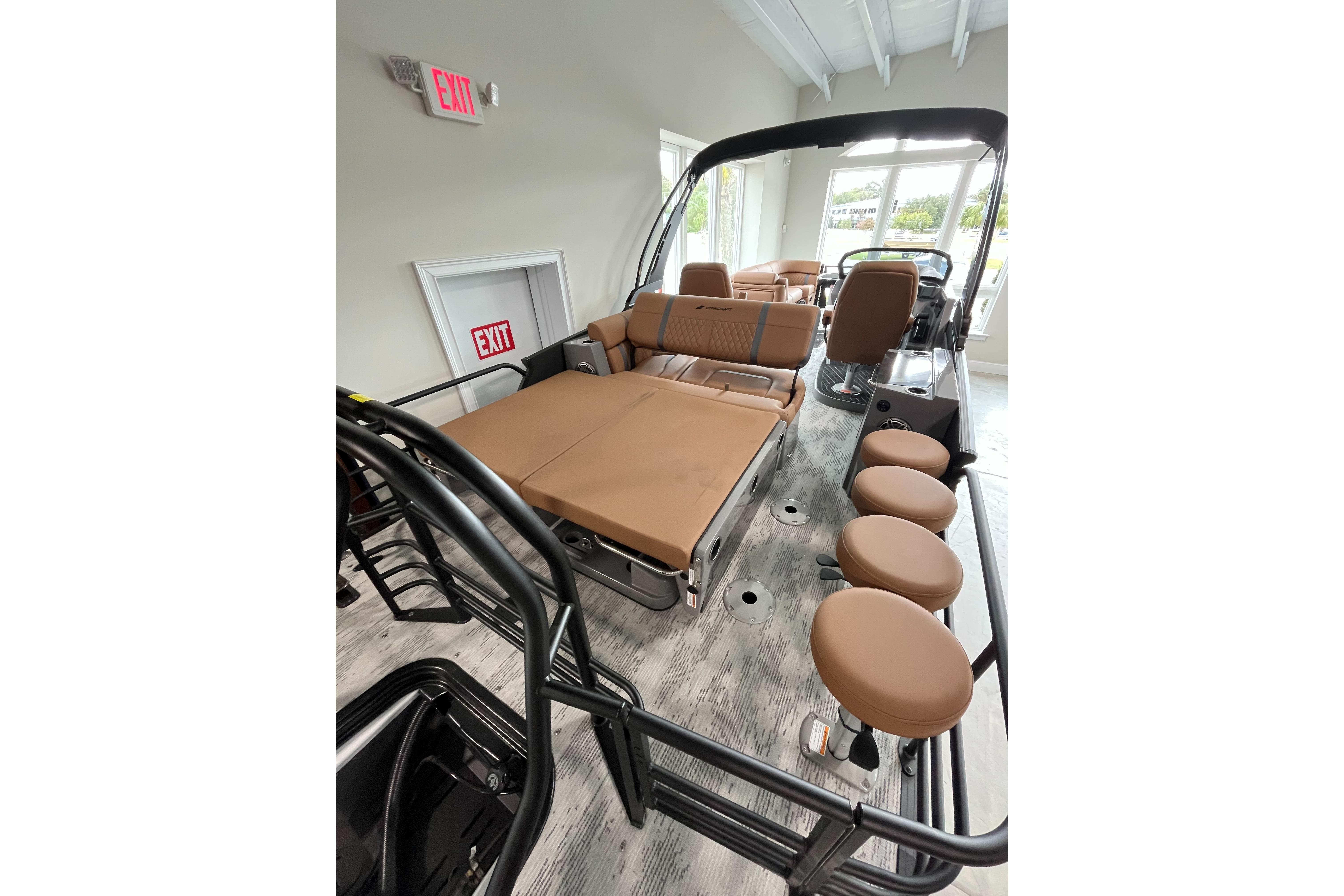 2026 Starcraft RX 25 DL DC boat interior with tan seating and modern design.
