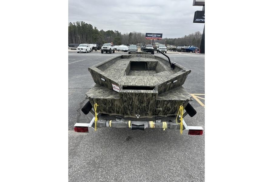 2026 SeaArk 1752 Slayer X boat on trailer, camo design, parked in lot.