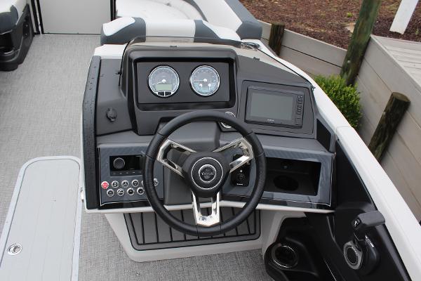 2025 Tahoe Pontoon Cascade Quad Lounger dashboard with steering wheel and control panel.
