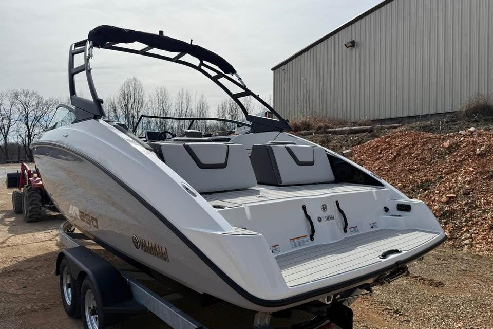 2026 Yamaha Boats AR250 on trailer, sleek design, outdoor setting.