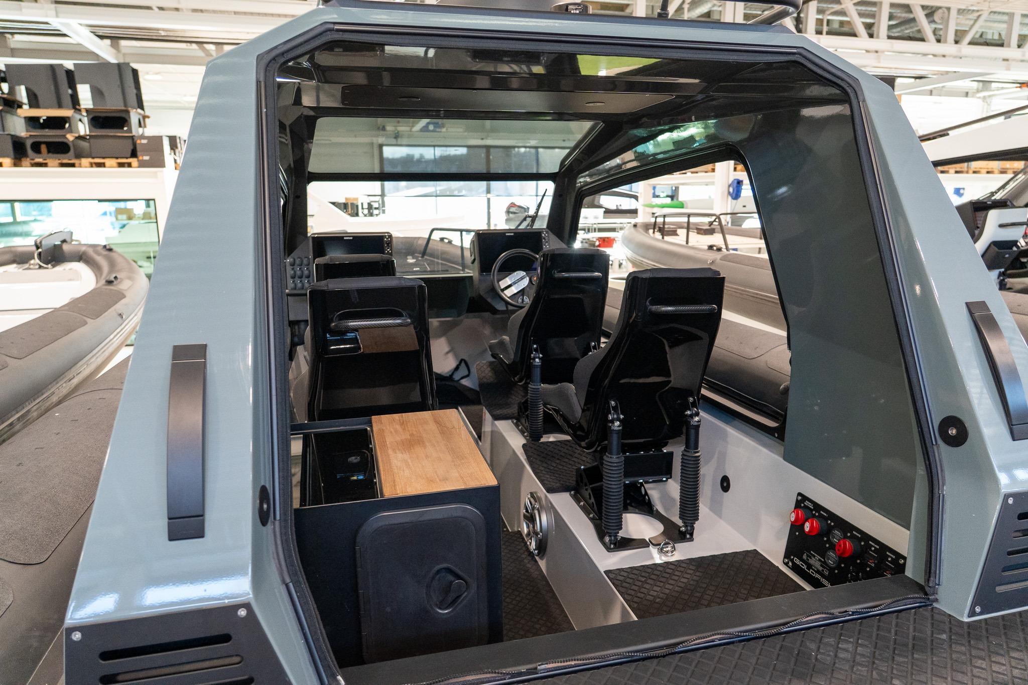 Interior view of 2024 Goldfish X10 EXPLORER boat cockpit with modern seating and controls.