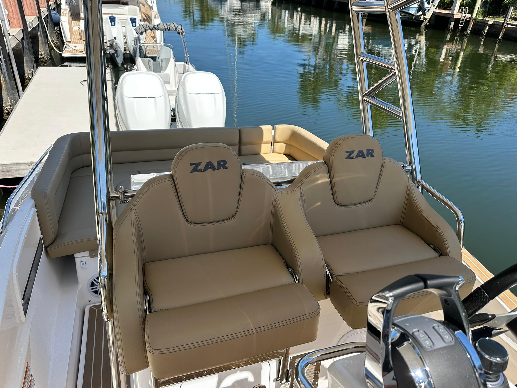2022 Zar Formenti 95 SL boat with tan seats, dual engines, and sleek design.
