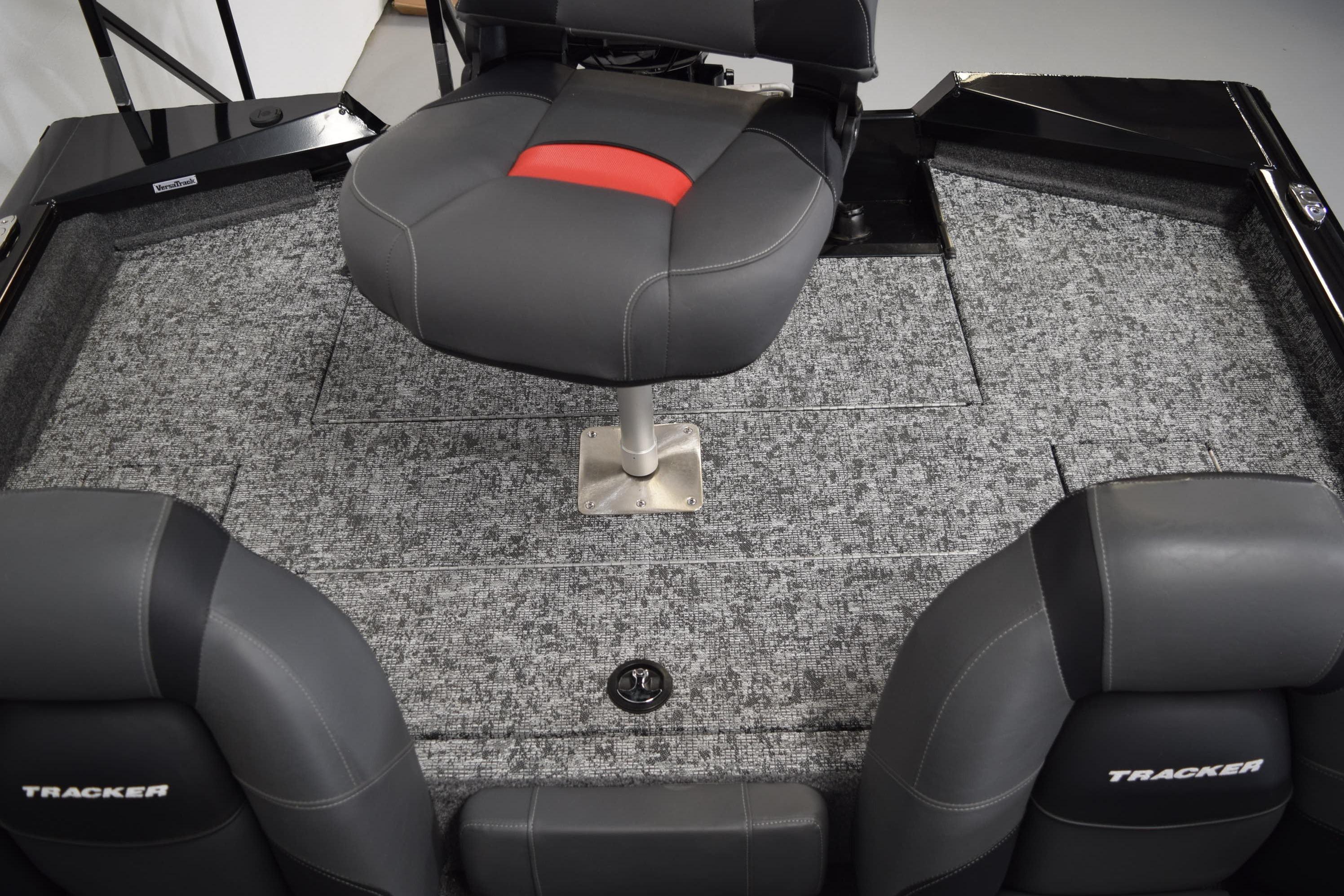 2026 Tracker Pro Team 175 boat interior with gray seating and carpeted flooring.