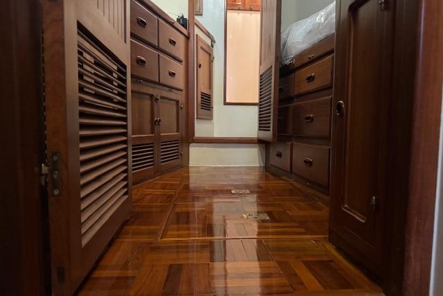 1986 Krogen 42 Classic yacht interior with polished wooden cabinetry and flooring.