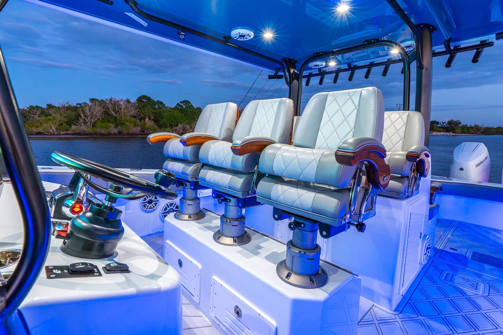 Luxurious interior of 2025 Freeman 43 boat with plush seating and modern controls.