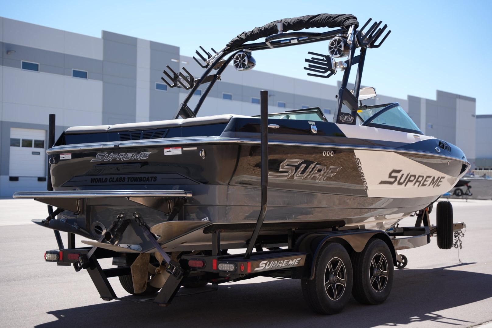 2016 Supreme S211 boat on trailer, showcasing sleek design and modern features.