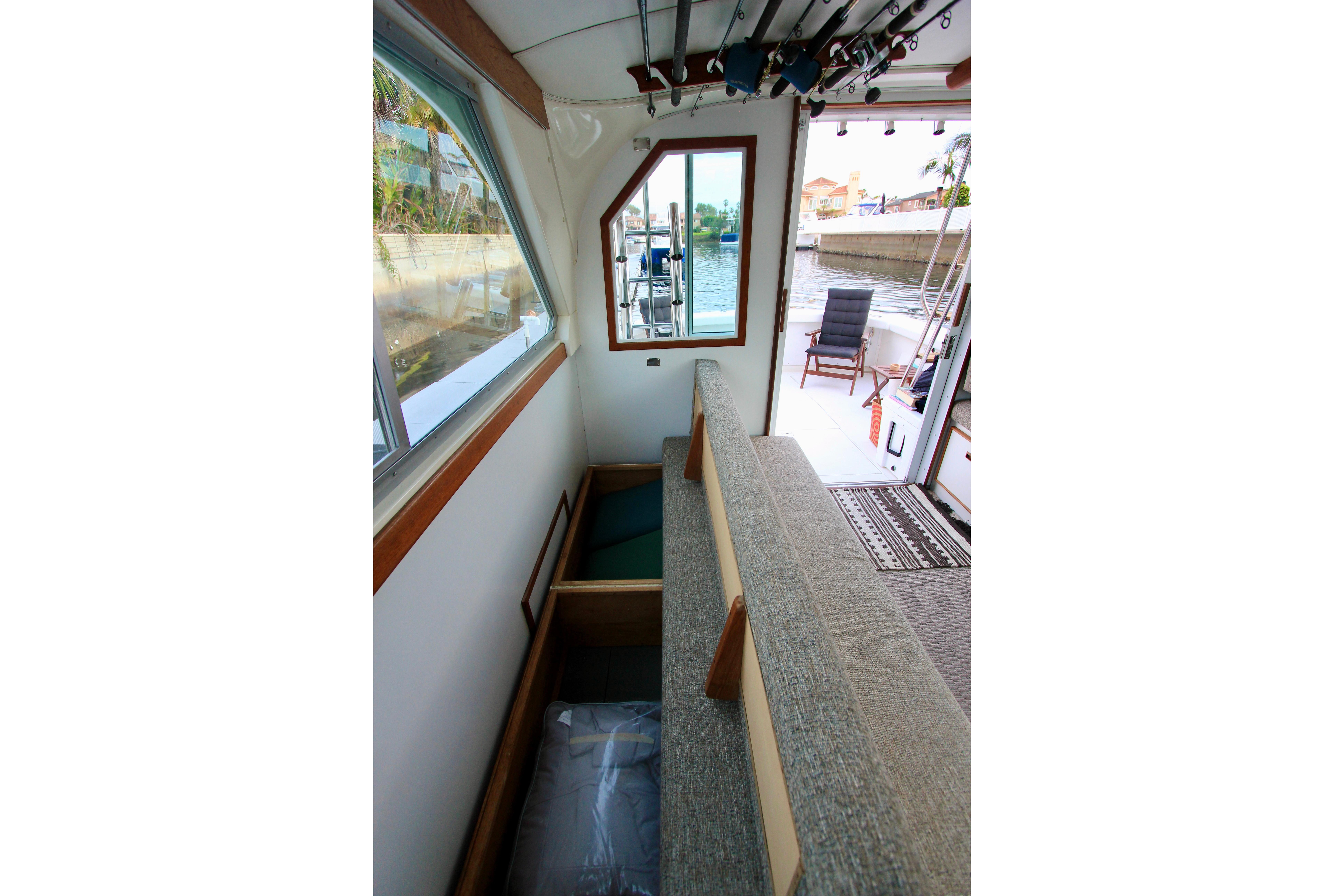 Ample storage under convertible sofa. Starboard side convertible sofa. Custom Interior by Crystaliner Corp.