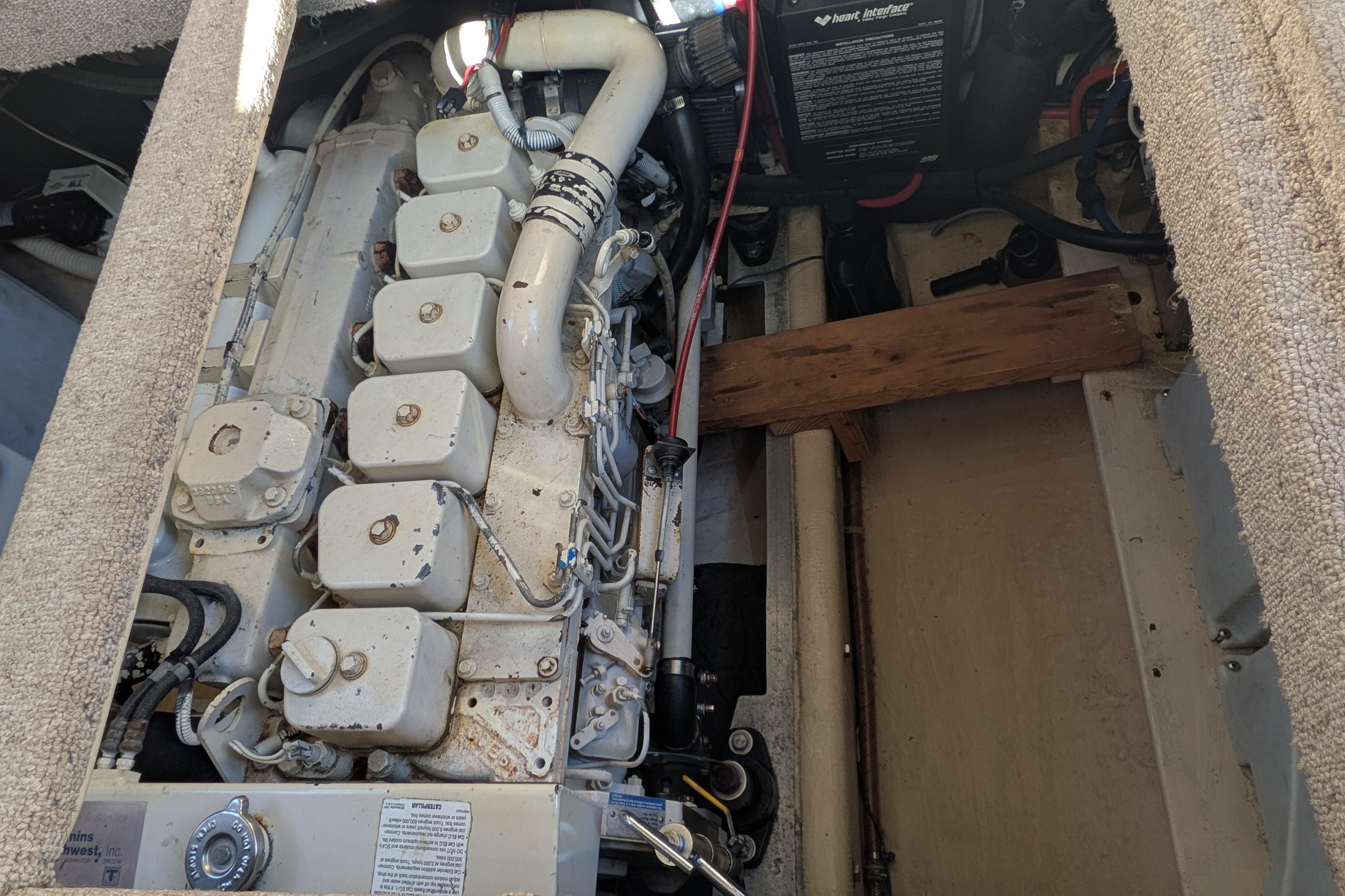 Engine compartment of a 1998 Nordic Tug 32, showcasing mechanical components and wiring.