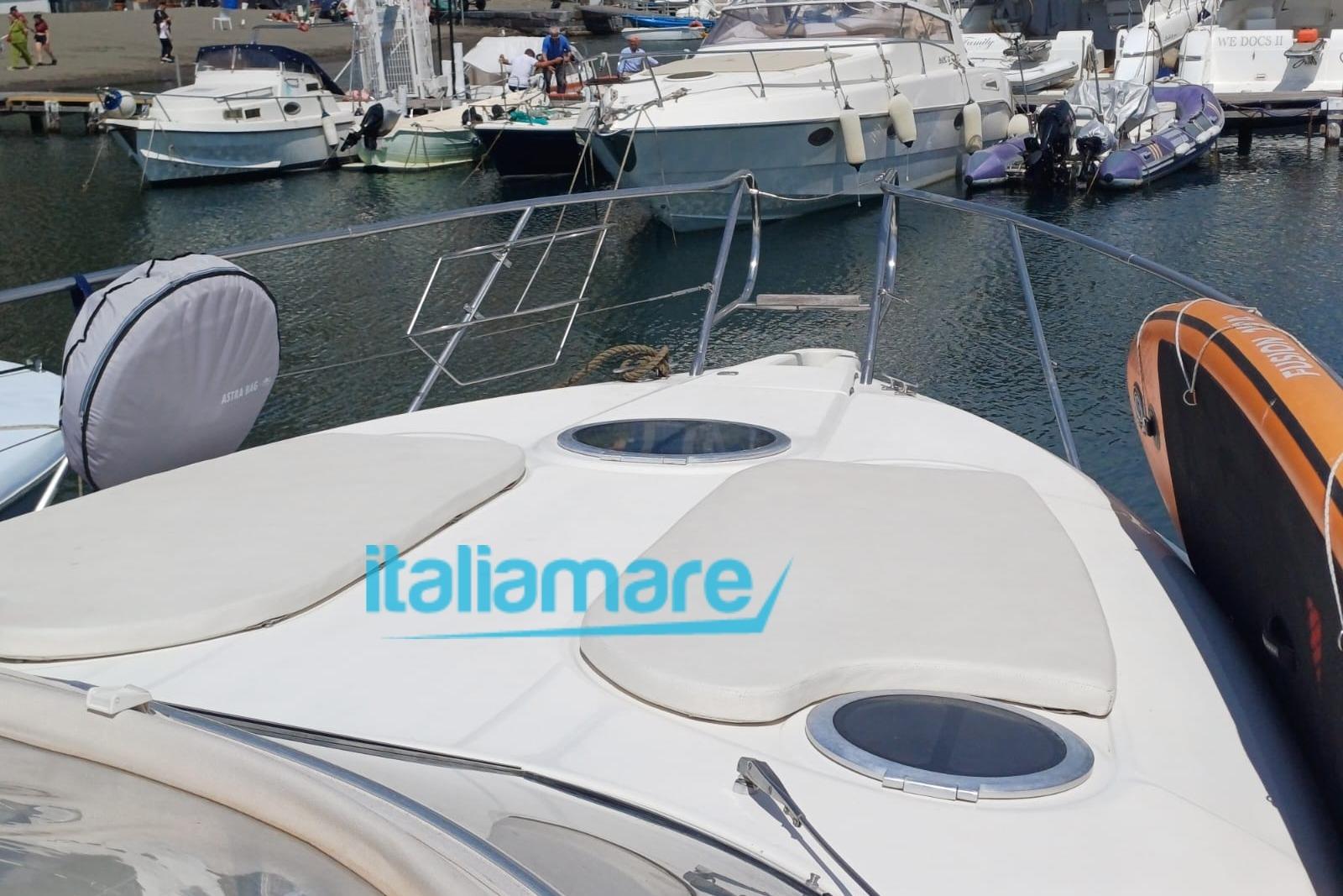 2006 Cranchi Zaffiro 34 yacht docked at marina, featuring spacious deck and sleek design.