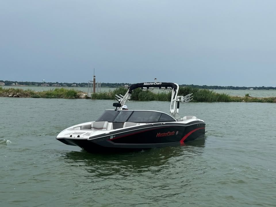 2015 MasterCraft X46 boat on calm water.