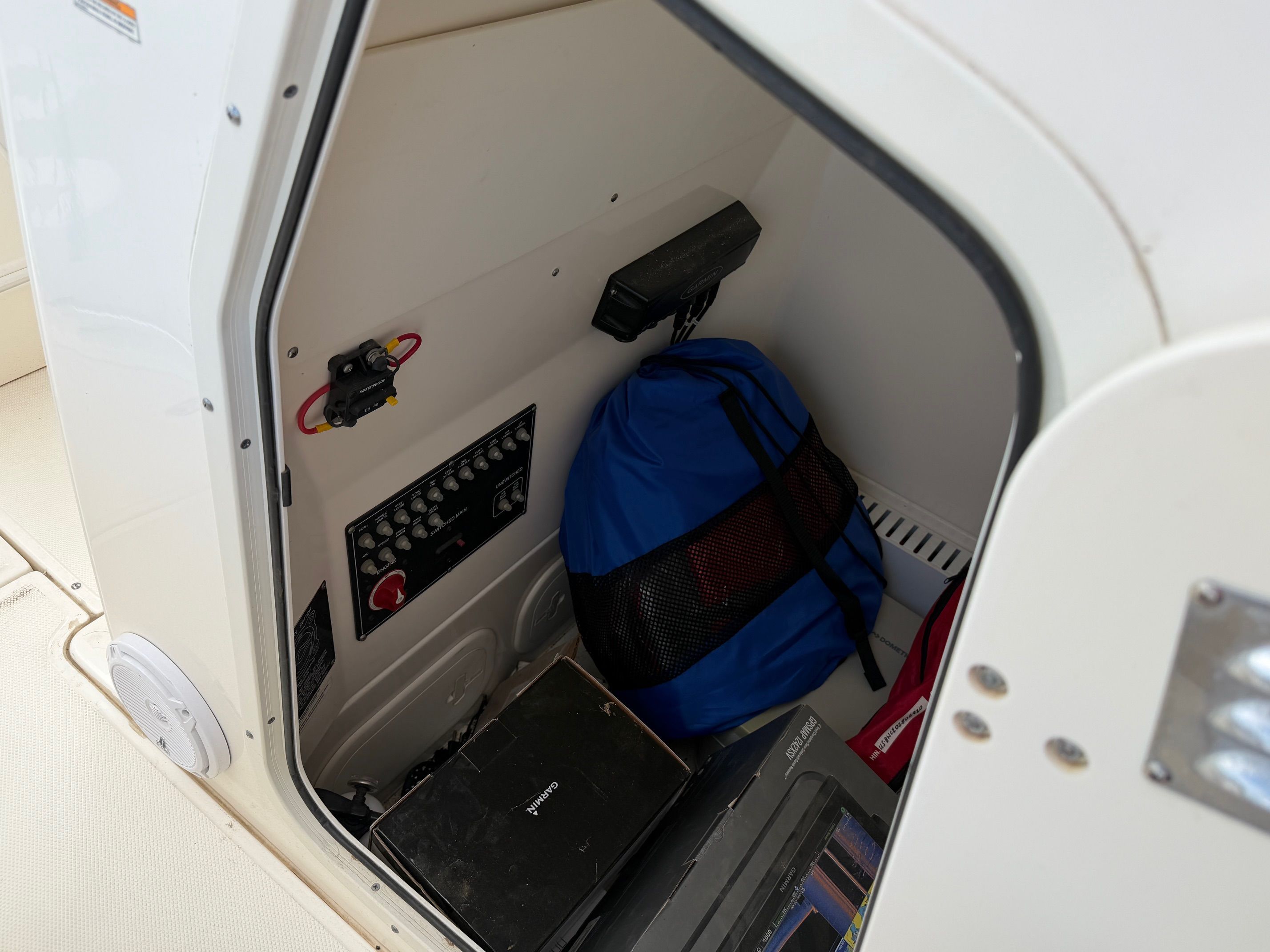 Storage compartment in Boston Whaler 230 Outrage boat, year 2020.