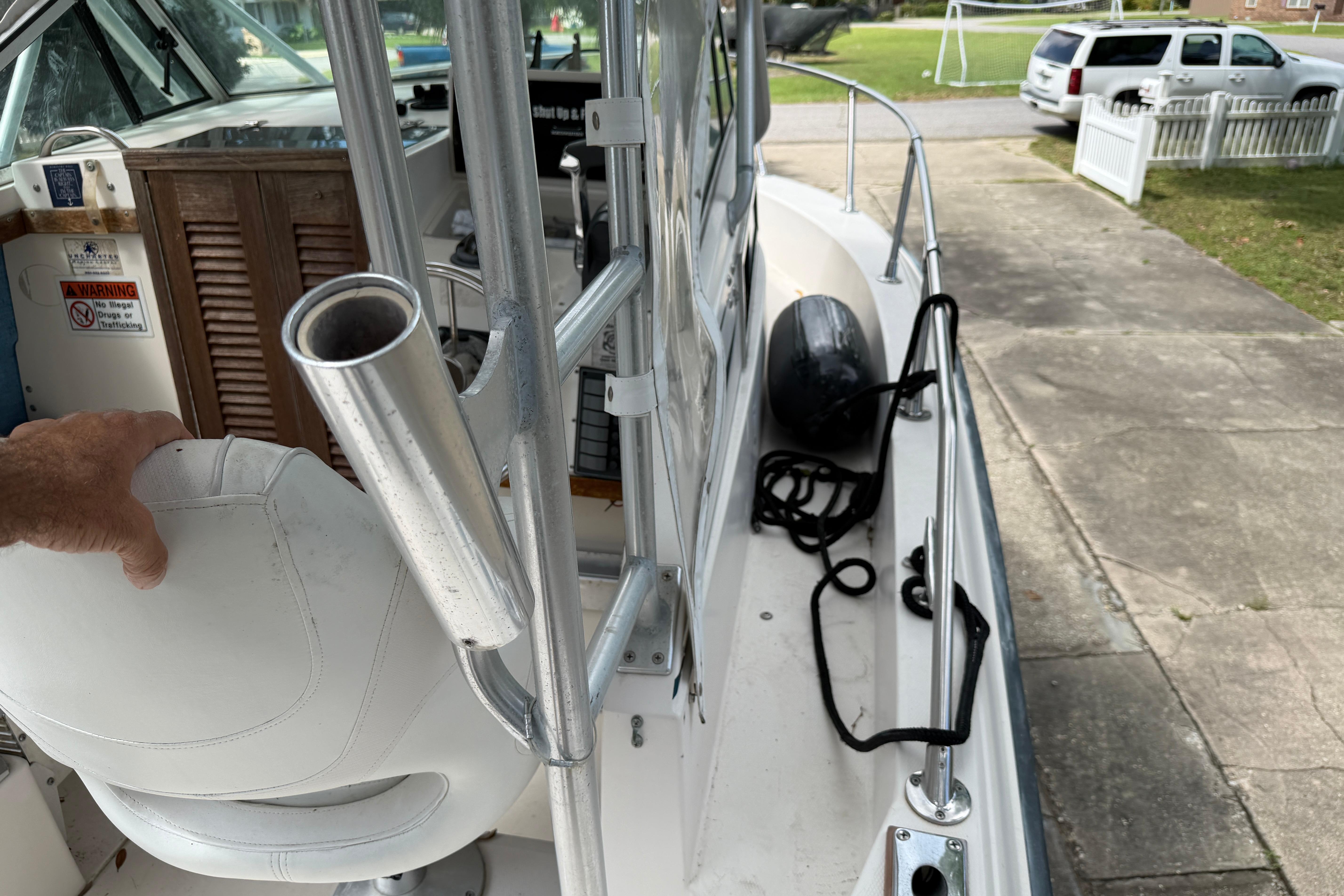 1987 Grady-White Seafarer 226 boat interior with rod holder and seating.