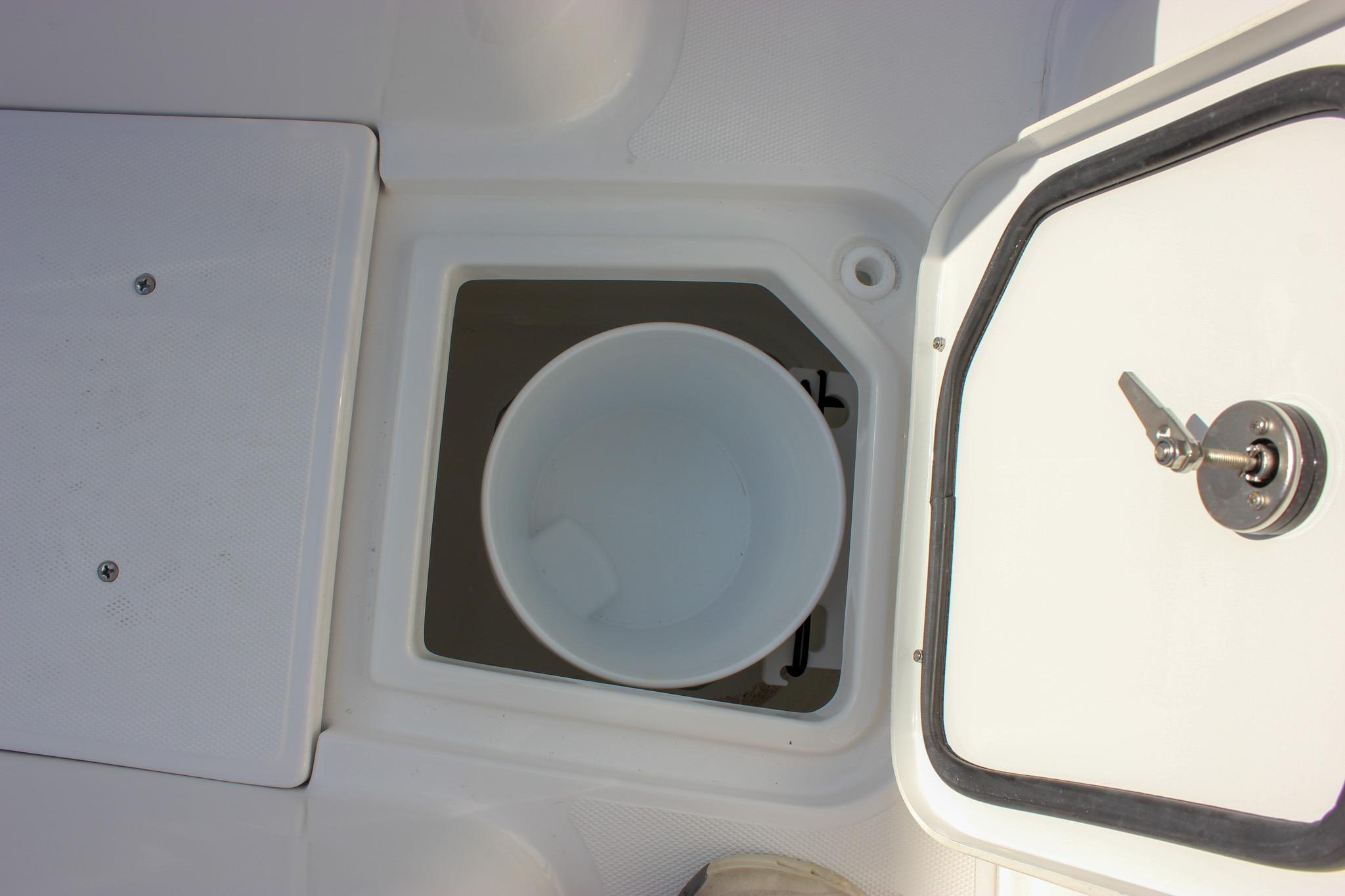 Storage compartment with bucket on 2027 Sea Hunt Ultra 275 SE boat.
