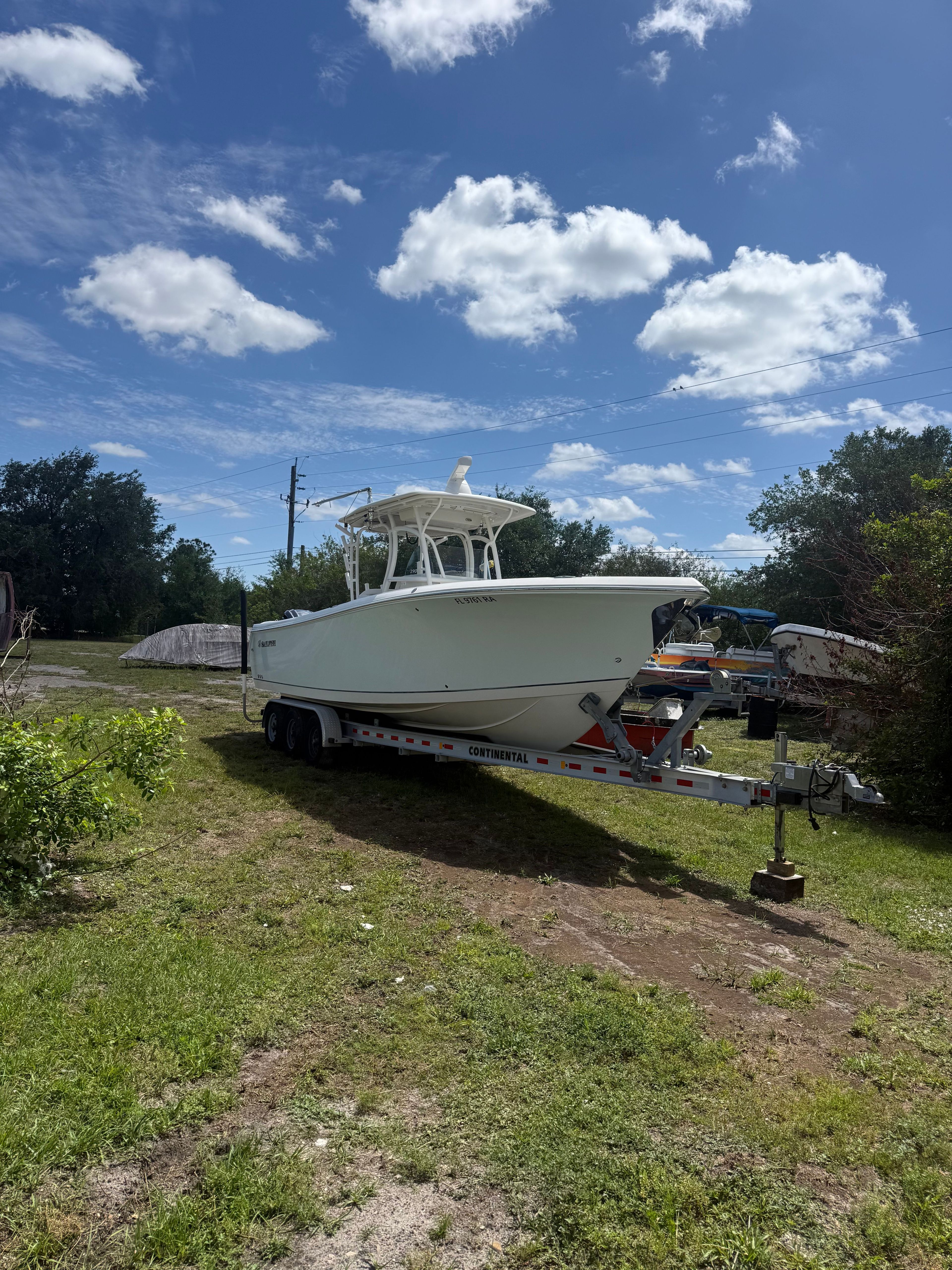 Sailfish 290 CC boat on trailer, 2015 model.