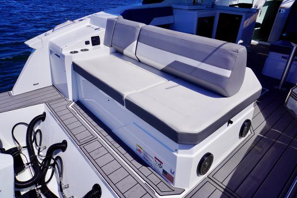 2020 Cruisers Yachts 38 GLS OB boat seating area with gray cushions and deck view.