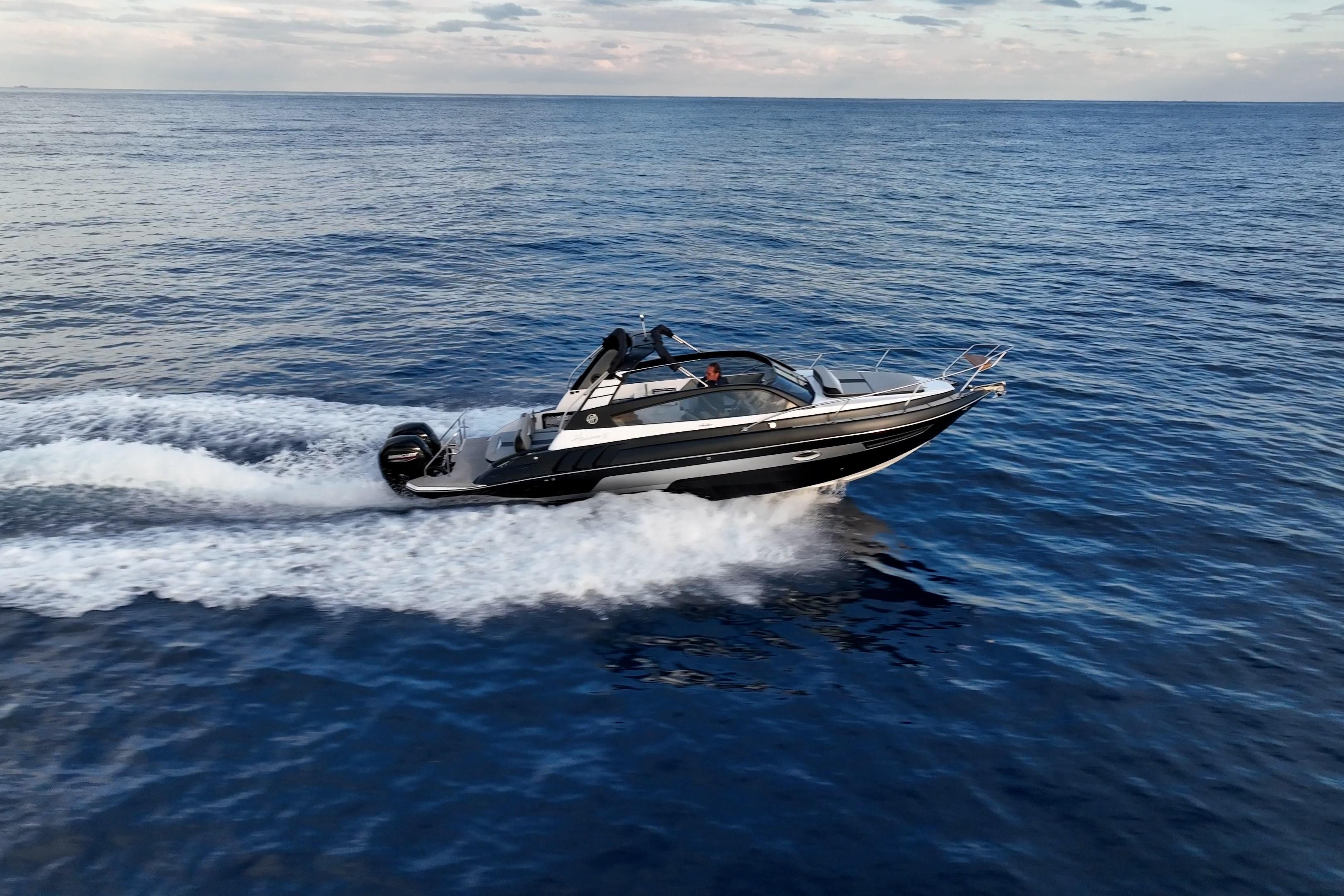 A sleek 2027 Hanover 305 speedboat cruising on open water under a clear sky.