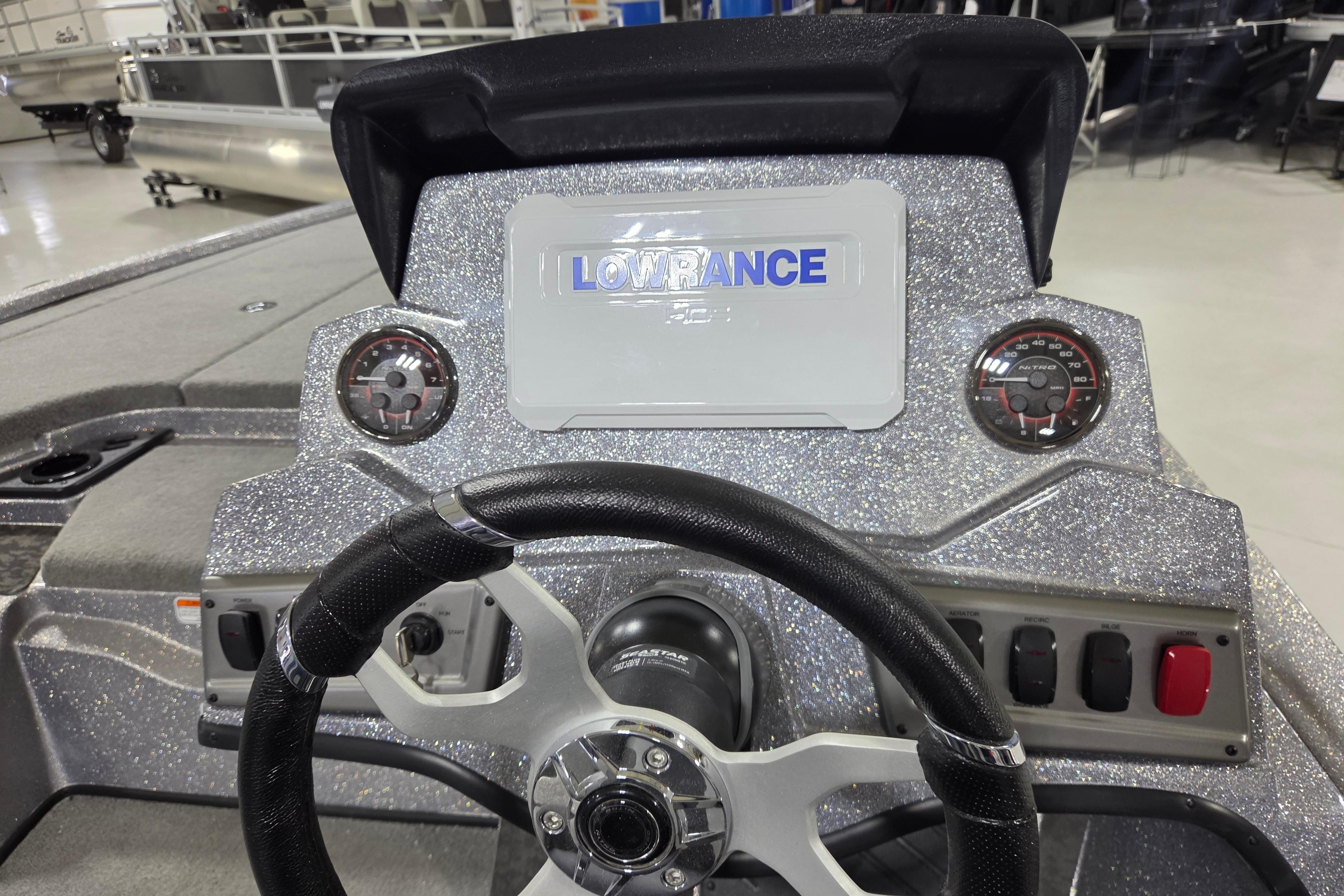 Steering console of 2026 Nitro Z19 XL boat with Lowrance display and gauges.