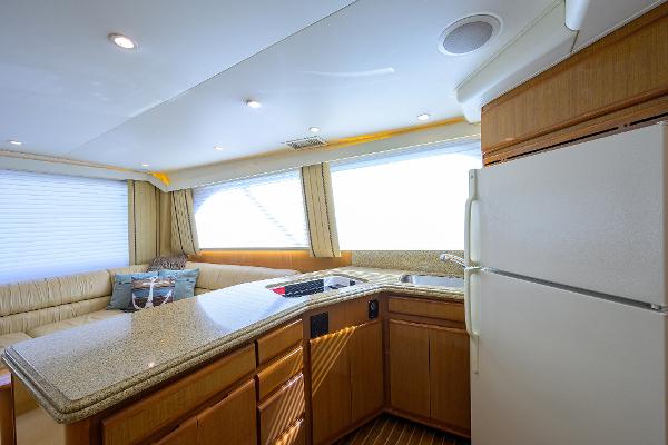 Interior of 2000 Viking 50 Convertible yacht with modern kitchen and seating area.