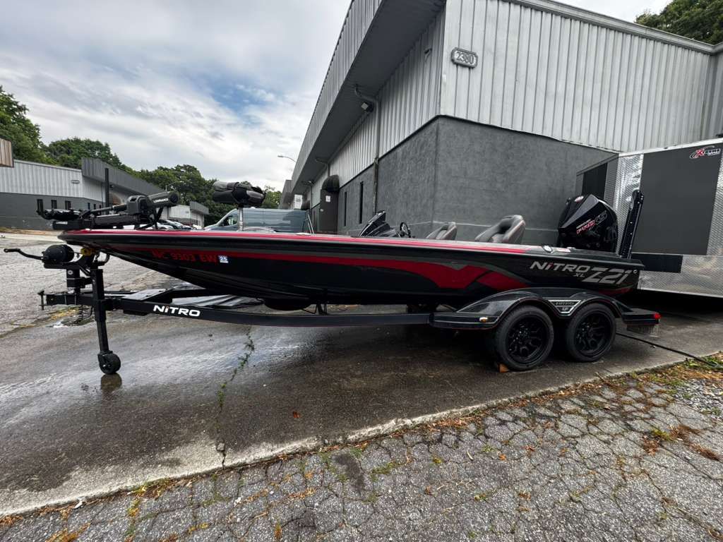 2022 Nitro Z21 XL Pro boat on trailer outside building.