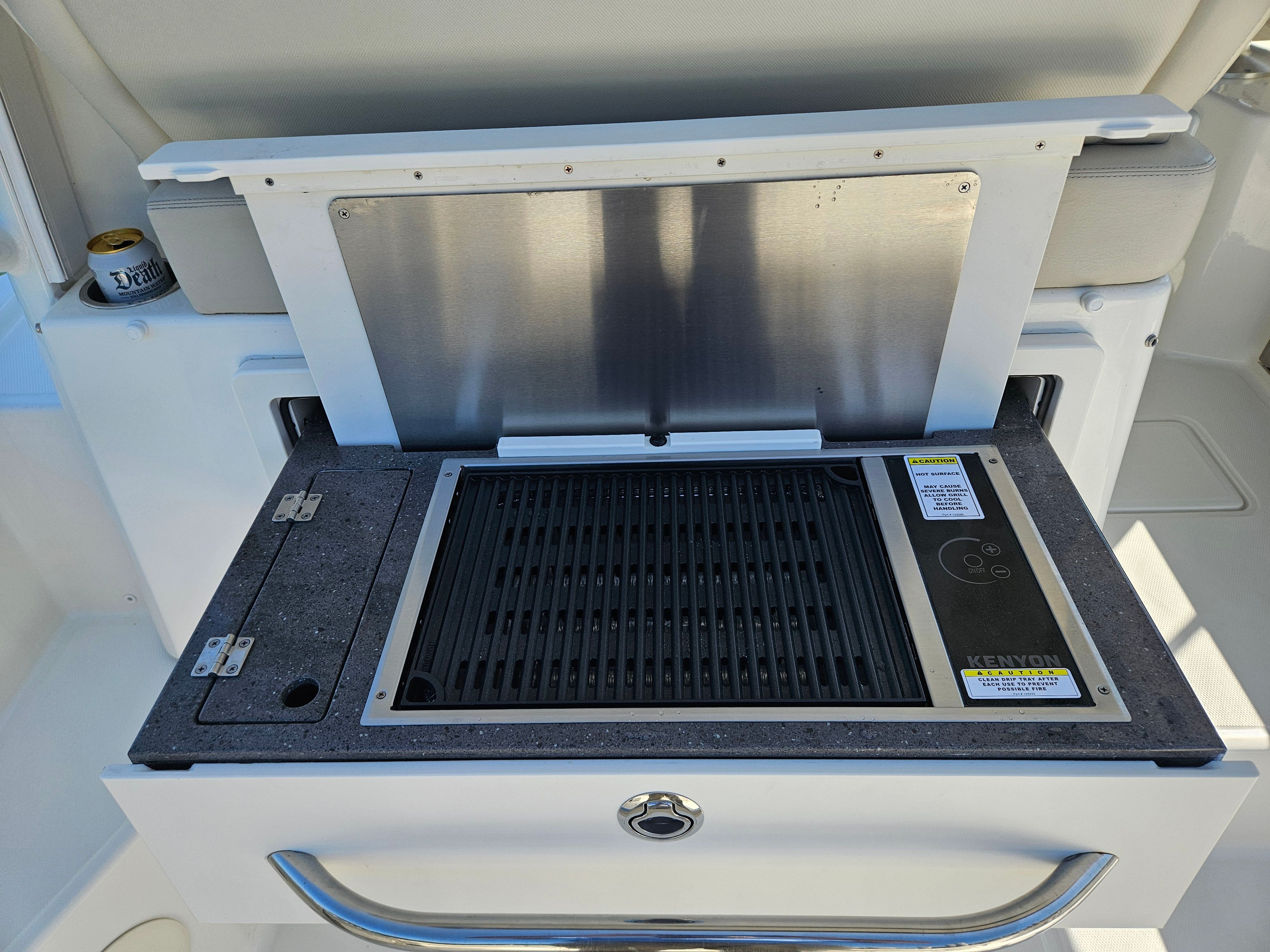 A built-in grill on a Boston Whaler 325 Conquest boat.