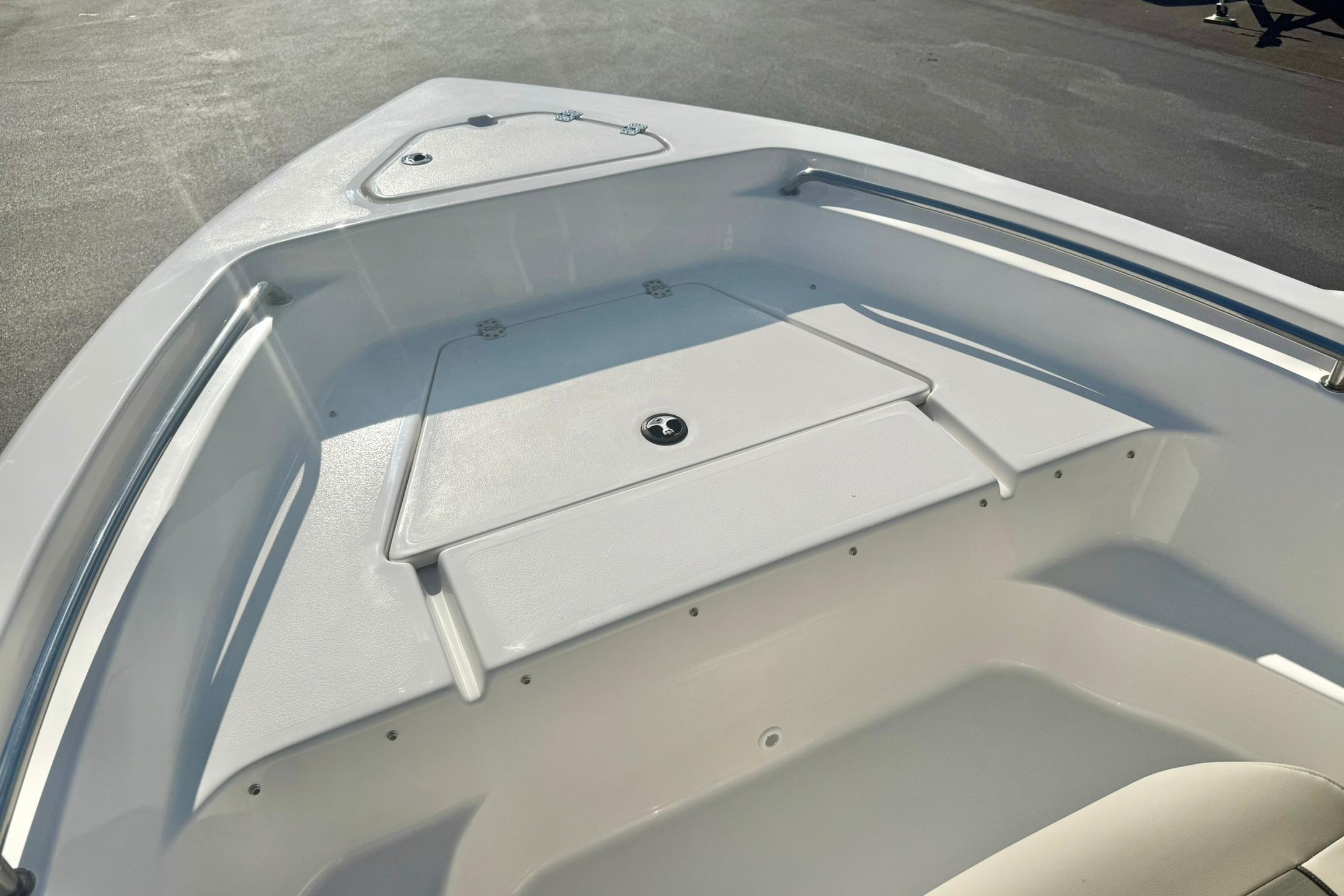 2026 Key West 189 FS boat bow area with storage compartment and seating.