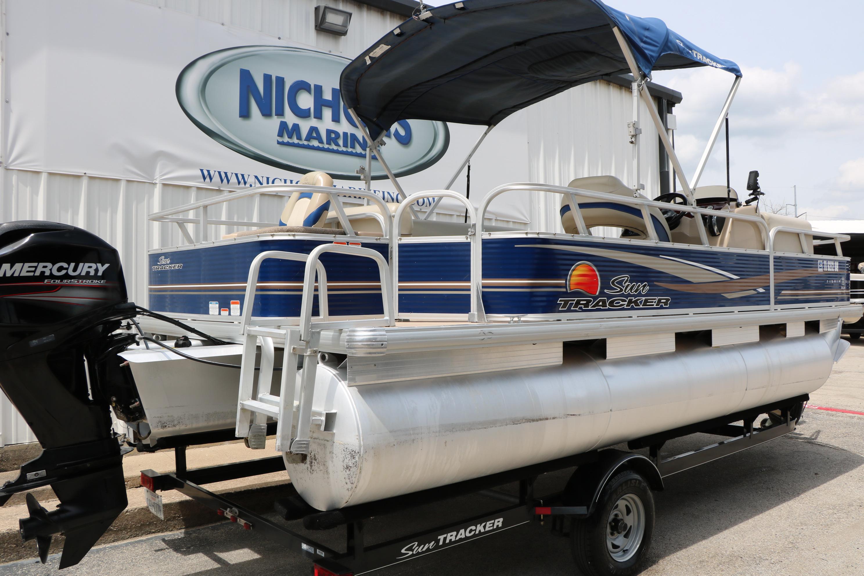 2013 Sun Tracker Fishin' Barge 20 DLX pontoon boat with Mercury engine at dealership.