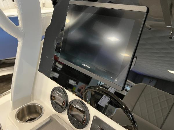 2024 Sea Fox 231 Bay boat dashboard with Garmin display and gauges.