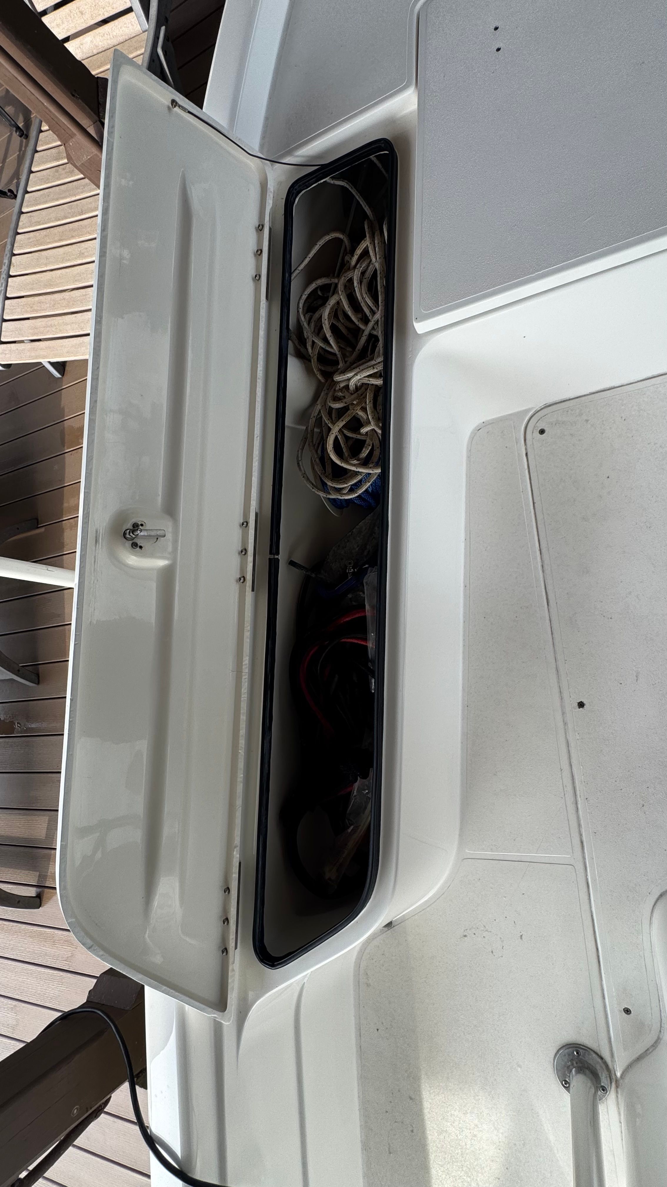 Open storage compartment on a 2004 ShearWater LTZ boat.