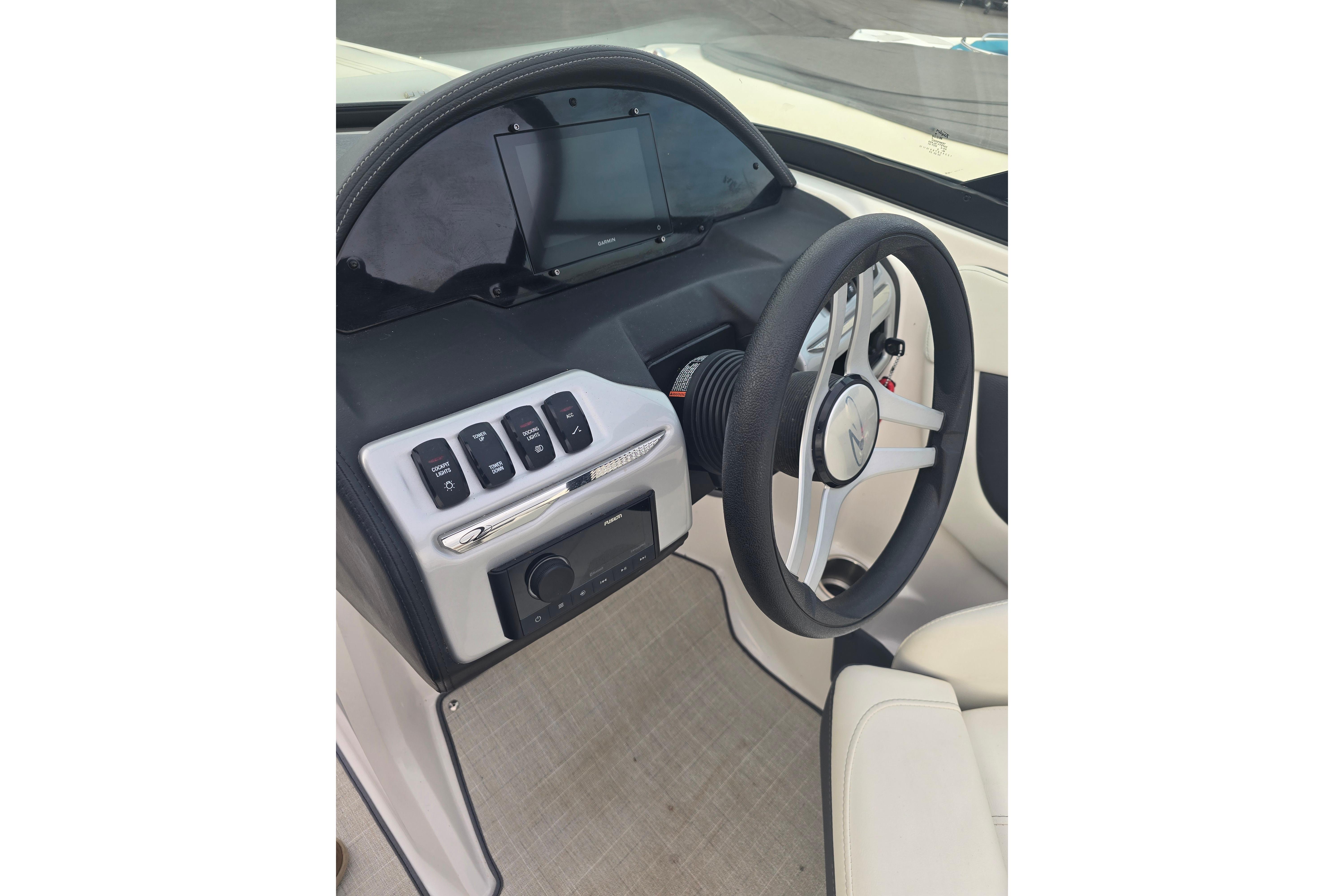 2022 Regal 2000 ES boat dashboard with steering wheel and control panel.