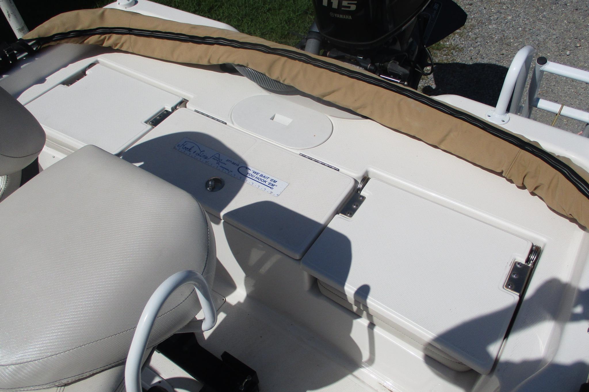 2021 Blue Wave 2000 PureBay boat interior with seating and storage compartments.