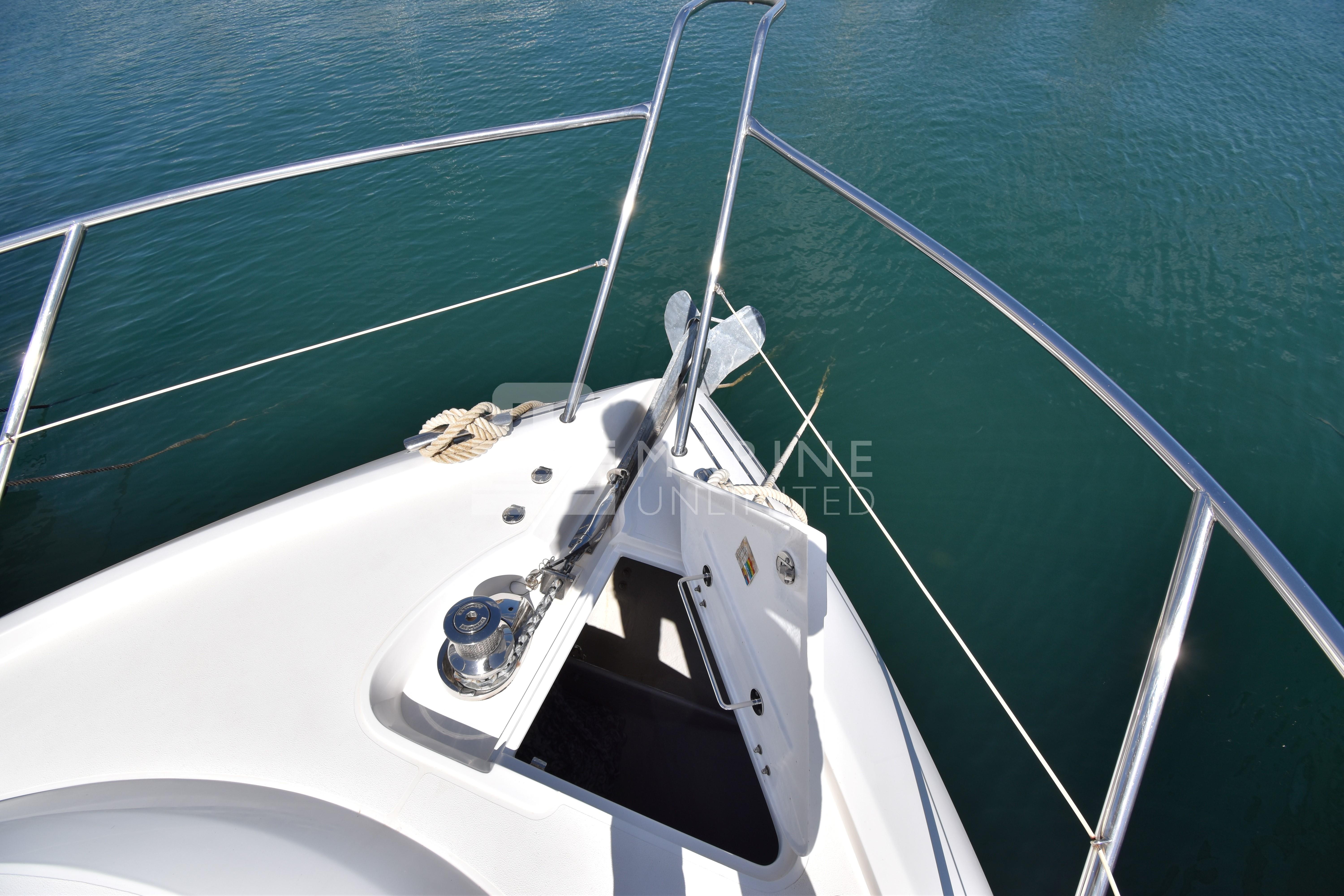 Bow of 2010 Sunseeker Manhattan 52 yacht with anchor and railing.