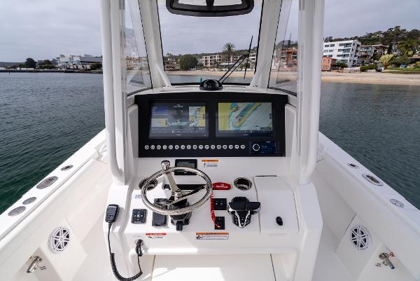 Interior view of 2025 Regulator 28 boat cockpit with modern electronics.