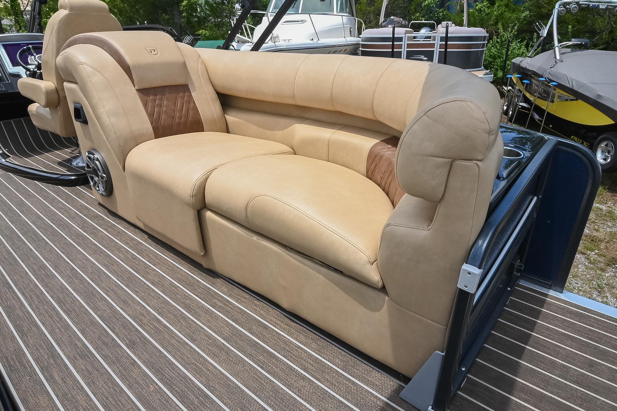 Luxurious seating on 2023 Premier 270 Intrigue RF boat, featuring plush beige upholstery.