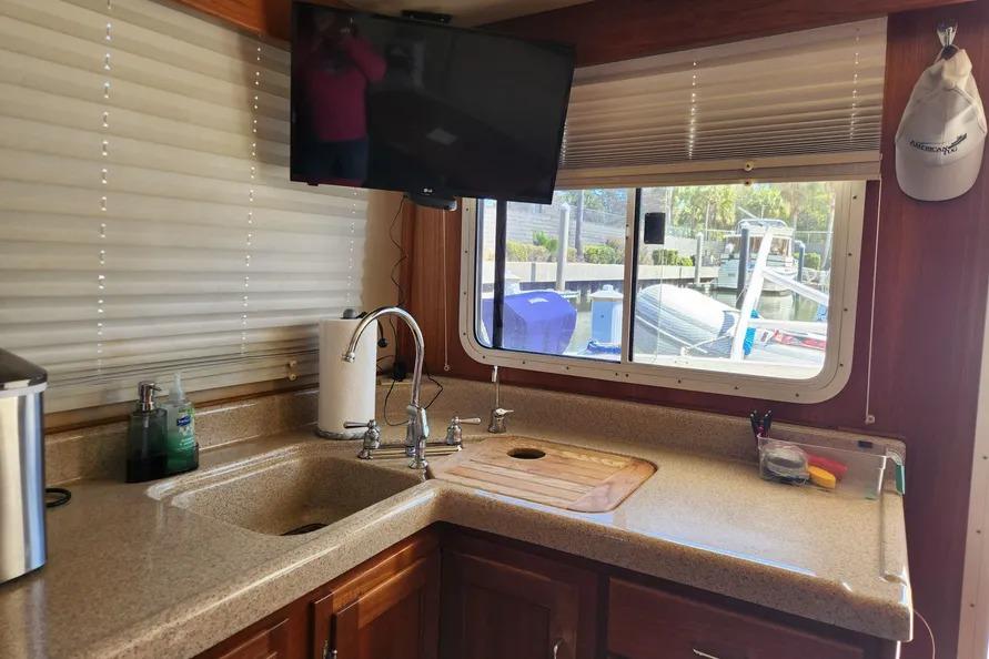 Interior of 2006 American Tug AT with kitchen sink, countertop, and window view.
